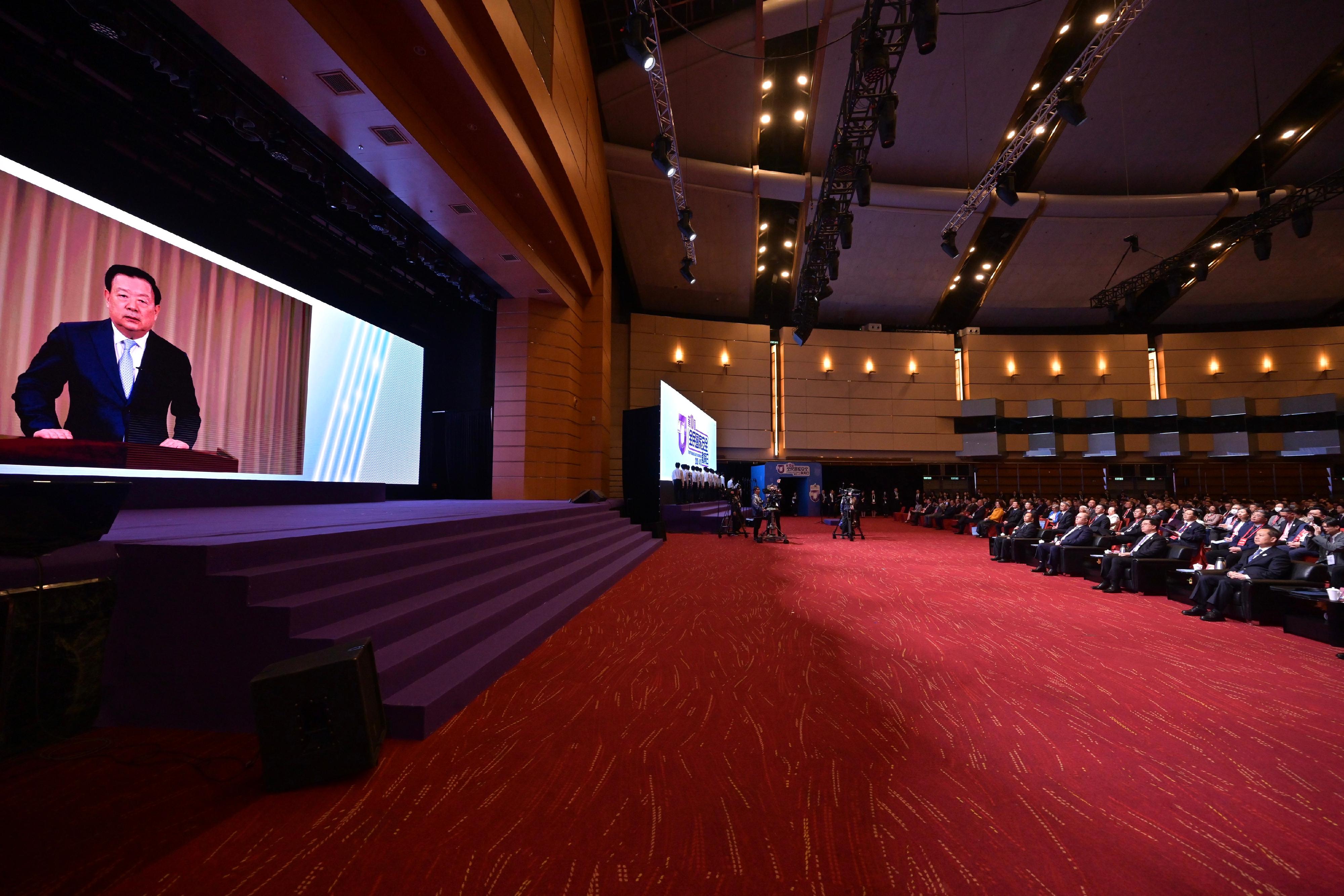 The Chief Executive and Chairman of the Committee for Safeguarding National Security of the Hong Kong Special Administrative Region, Mr John Lee, attended the National Security Education Day Opening Ceremony today (April 15). Photo shows Mr Lee (first row, second right) listening to the Director of the Hong Kong and Macao Work Office of the Communist Party of China Central Committee and the Hong Kong and Macao Affairs Office of the State Council, Mr Xia Baolong (on screen), delivering a speech via videoconferencing.