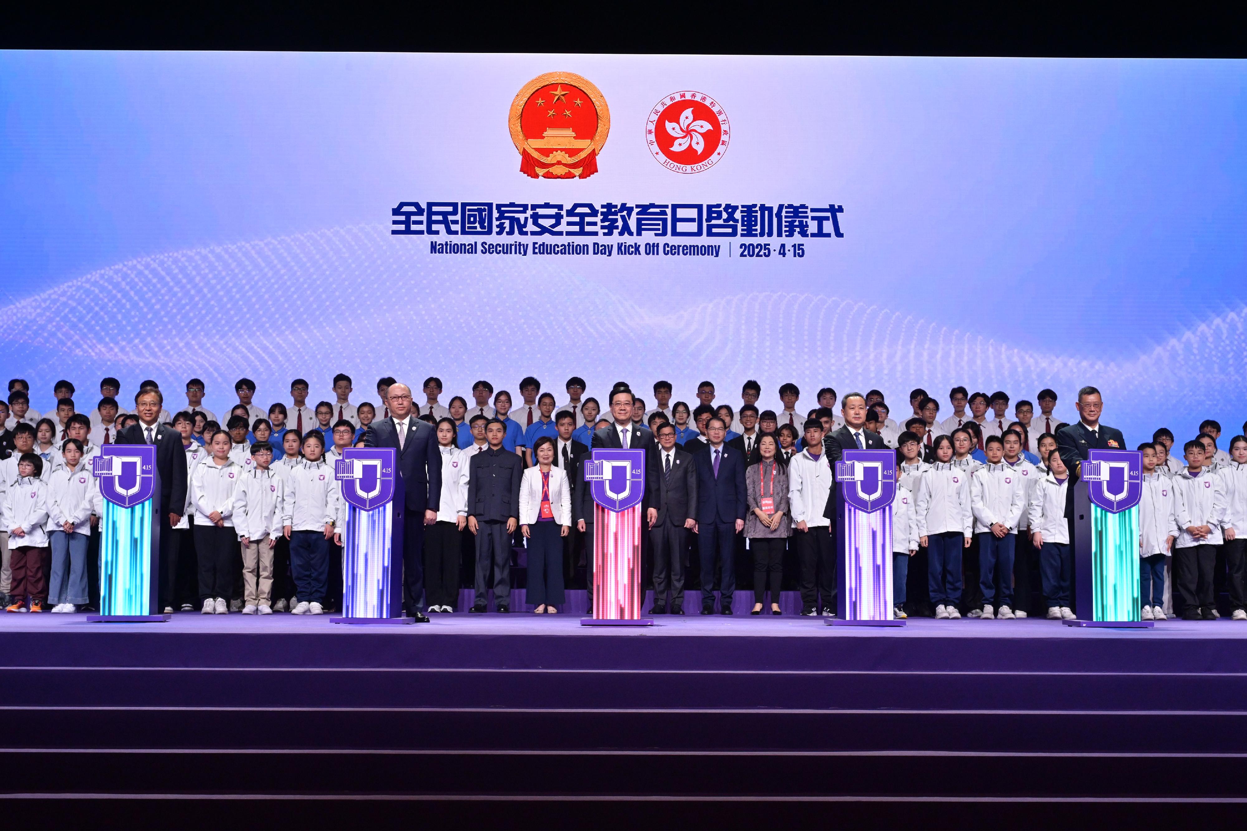 The Chief Executive and the Chairman of the National Security Committee of the Hong Kong Special Administrative Region (HKSAR), Mr John Lee, attended the National Security Education Day Opening Ceremony today (April 15). Photo shows (front row, from left) the Commissioner of the Ministry of Foreign Affairs of the People's Republic of China in the HKSAR, Mr Cui Jianchun; the Director of the Liaison Office of the Central People's Government in the HKSAR and the National Security Advisor of the National Security Committee, Mr Zheng Yanxiong; Mr Lee; the Head of the Office for Safeguarding National Security of the Central People's Government in the HKSAR, Mr Dong Jingwei; and the Political Commissar of the Chinese People's Liberation Army Hong Kong Garrison, Navy Rear Admiral Lai Ruxin, officiating at the opening ceremony.

