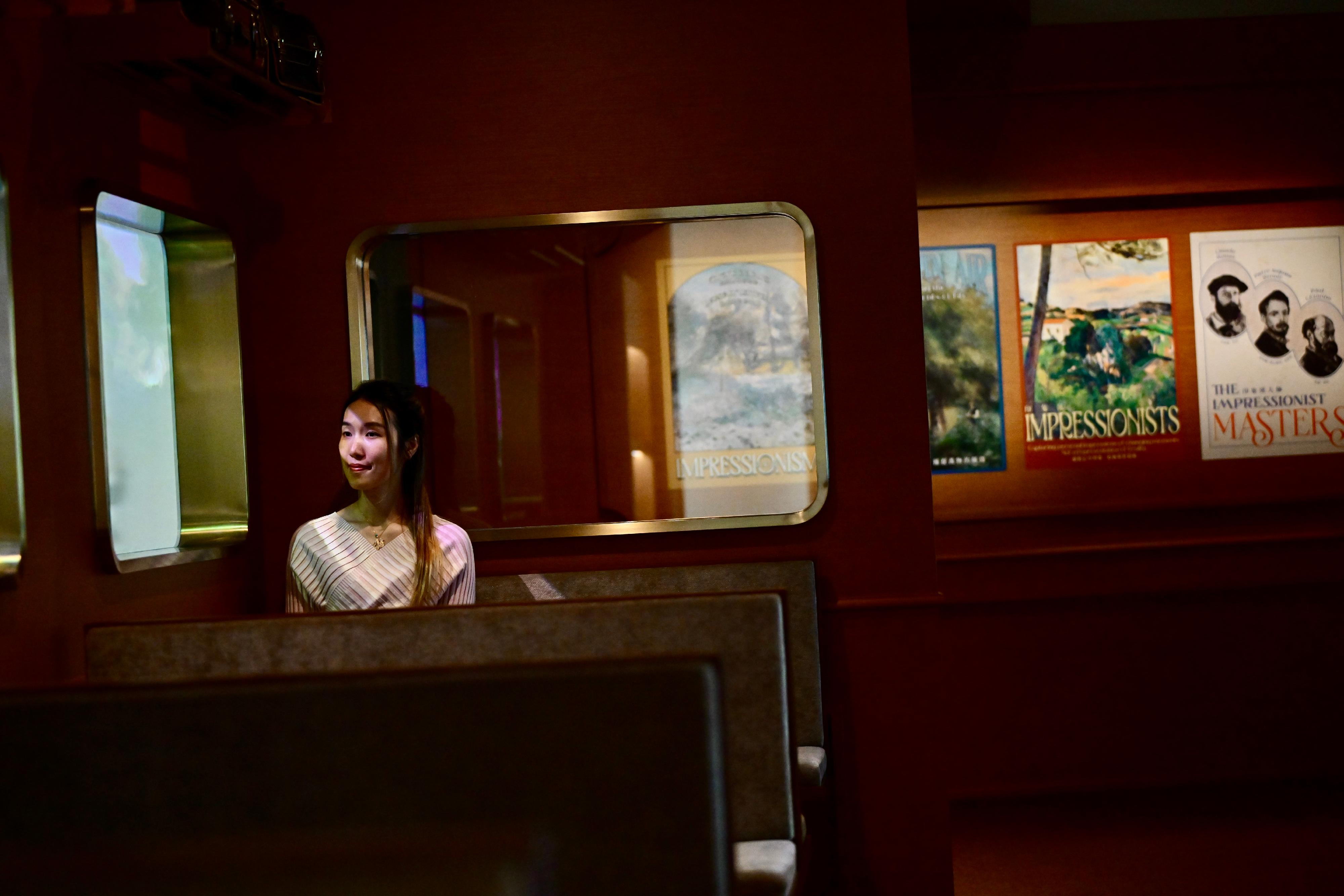 "The Hong Kong Jockey Club Series: Cézanne and Renoir Looking at the World - Masterpieces from the Musée de l’Orangerie and the Musée d’Orsay" exhibition at the Hong Kong Museum of Art (HKMoA) has been well received by the public since its opening. The museum will extend the exhibition period to May 14. Photo shows an education corner created by the HKMoA that mimics a French train platform with an interactive map, inviting visitors to board a time-travel train and immerse themselves in the creative worlds of Cézanne and Renoir.