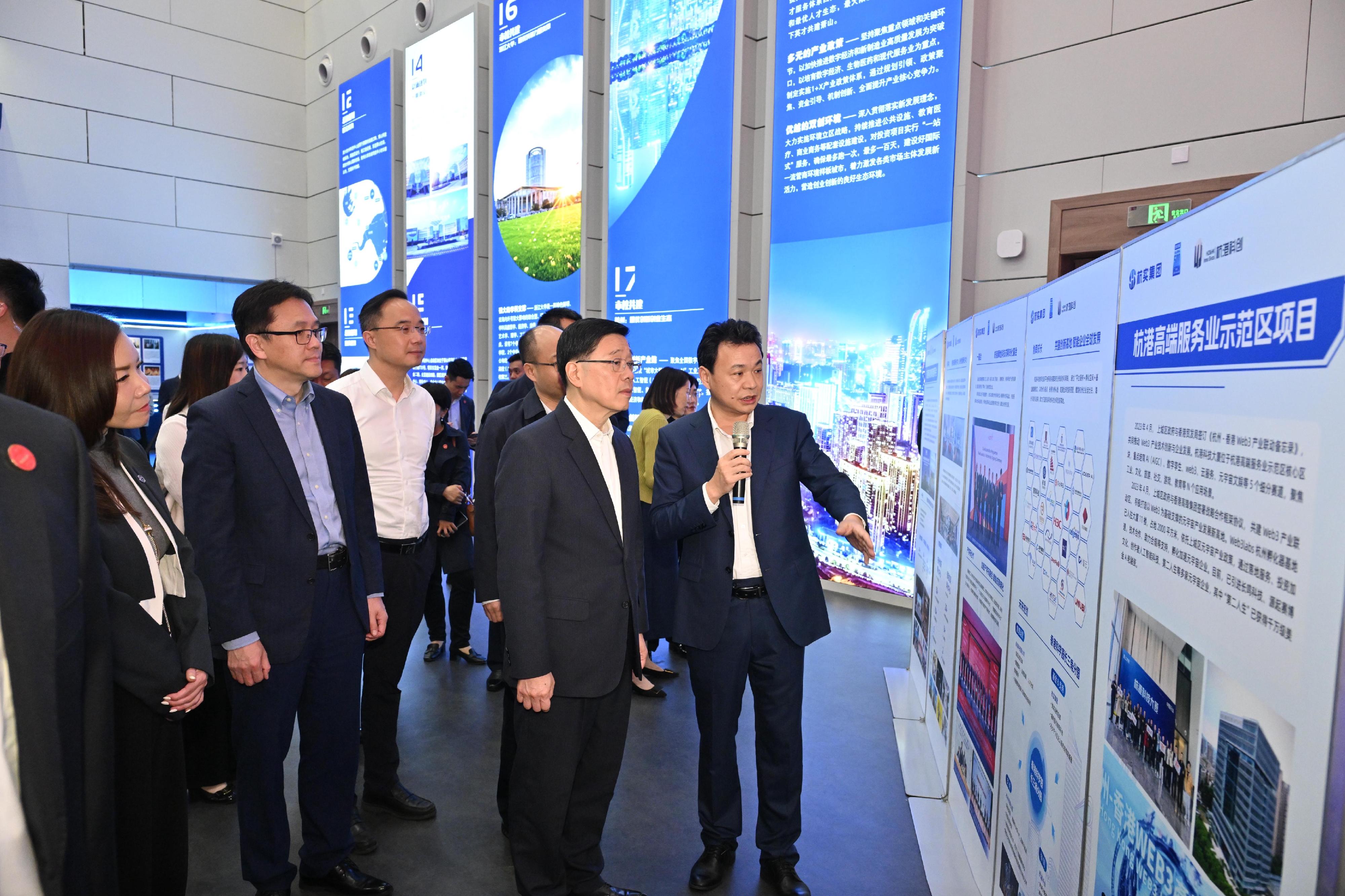 The Chief Executive, Mr John Lee, started his visit to Hangzhou today (April 22). Photo shows Mr Lee (second right) visiting the ZJU-Hangzhou Global Scientific and Technological Innovation Centre. The Secretary for Innovation, Technology and Industry, Professor Sun Dong (second left), also attends.