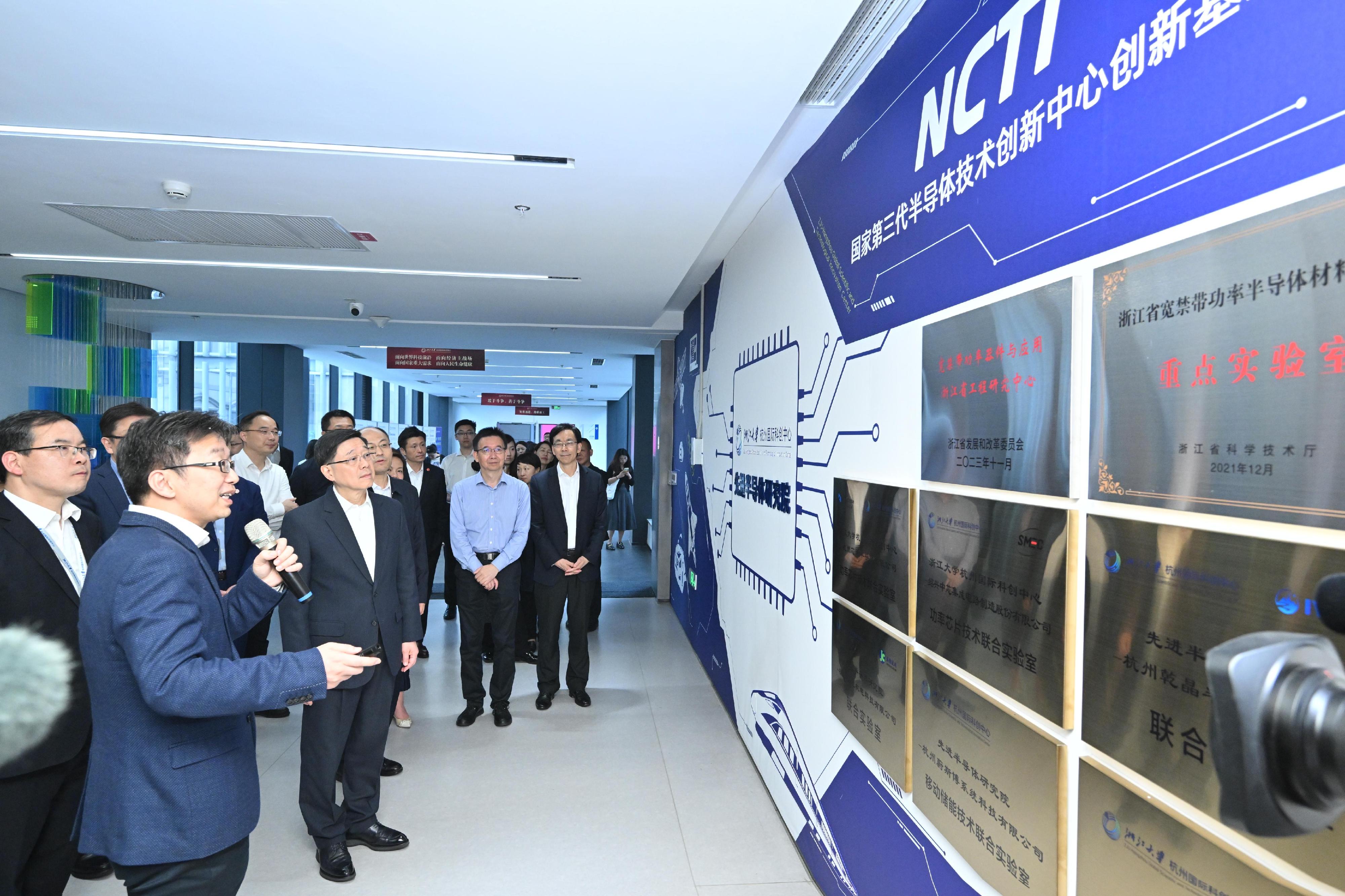 The Chief Executive, Mr John Lee, started his visit to Hangzhou today (April 22). Photo shows Mr Lee (third left) visiting the ZJU-Hangzhou Global Scientific and Technological Innovation Centre.
