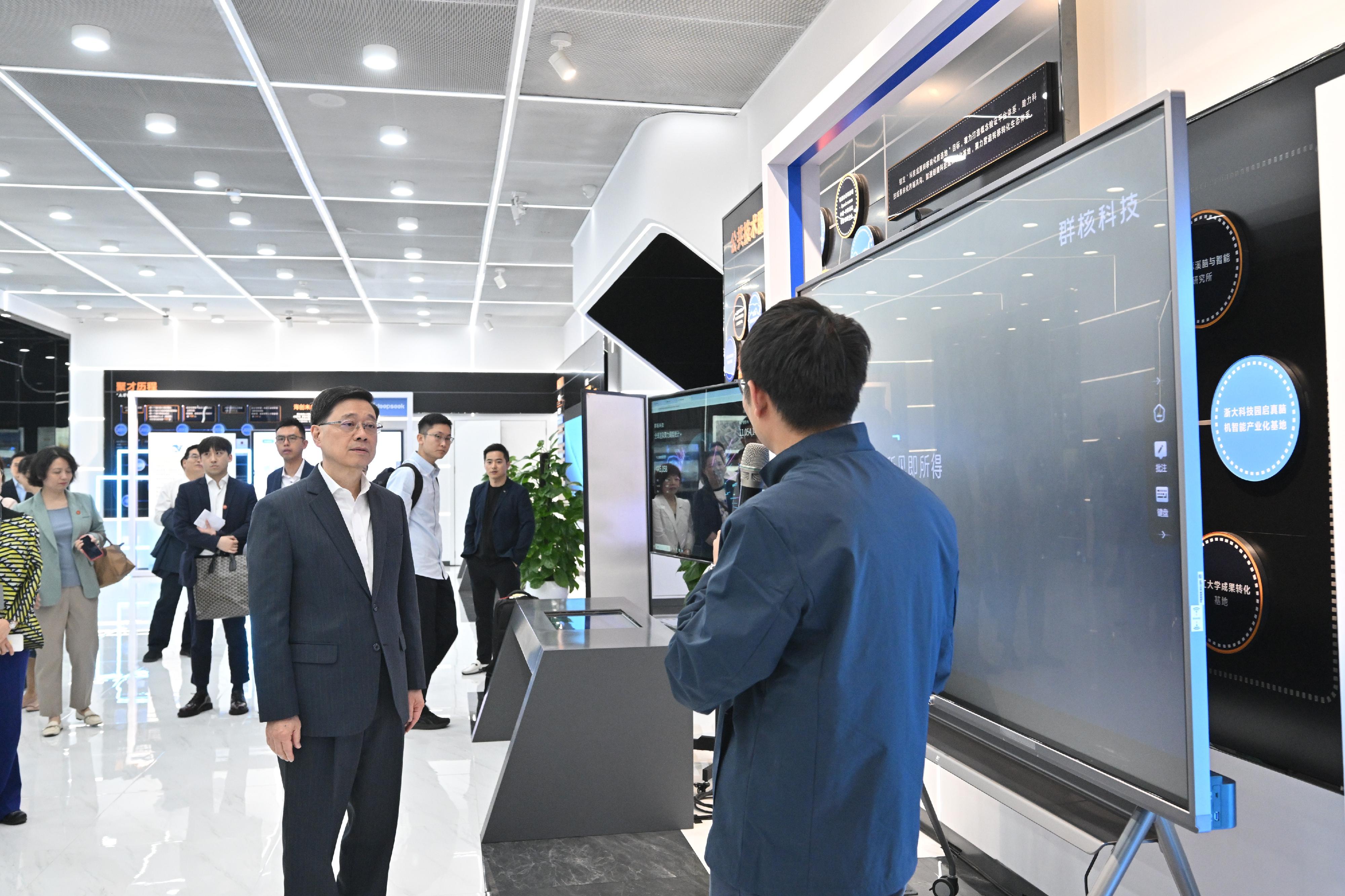The Chief Executive, Mr John Lee, continued his visit to Hangzhou today (April 23). Photo shows Mr Lee (left) visiting the Hangzhou Future Sci-Tech City Urban Exhibition Center and the exhibition of Manycore Tech Inc.