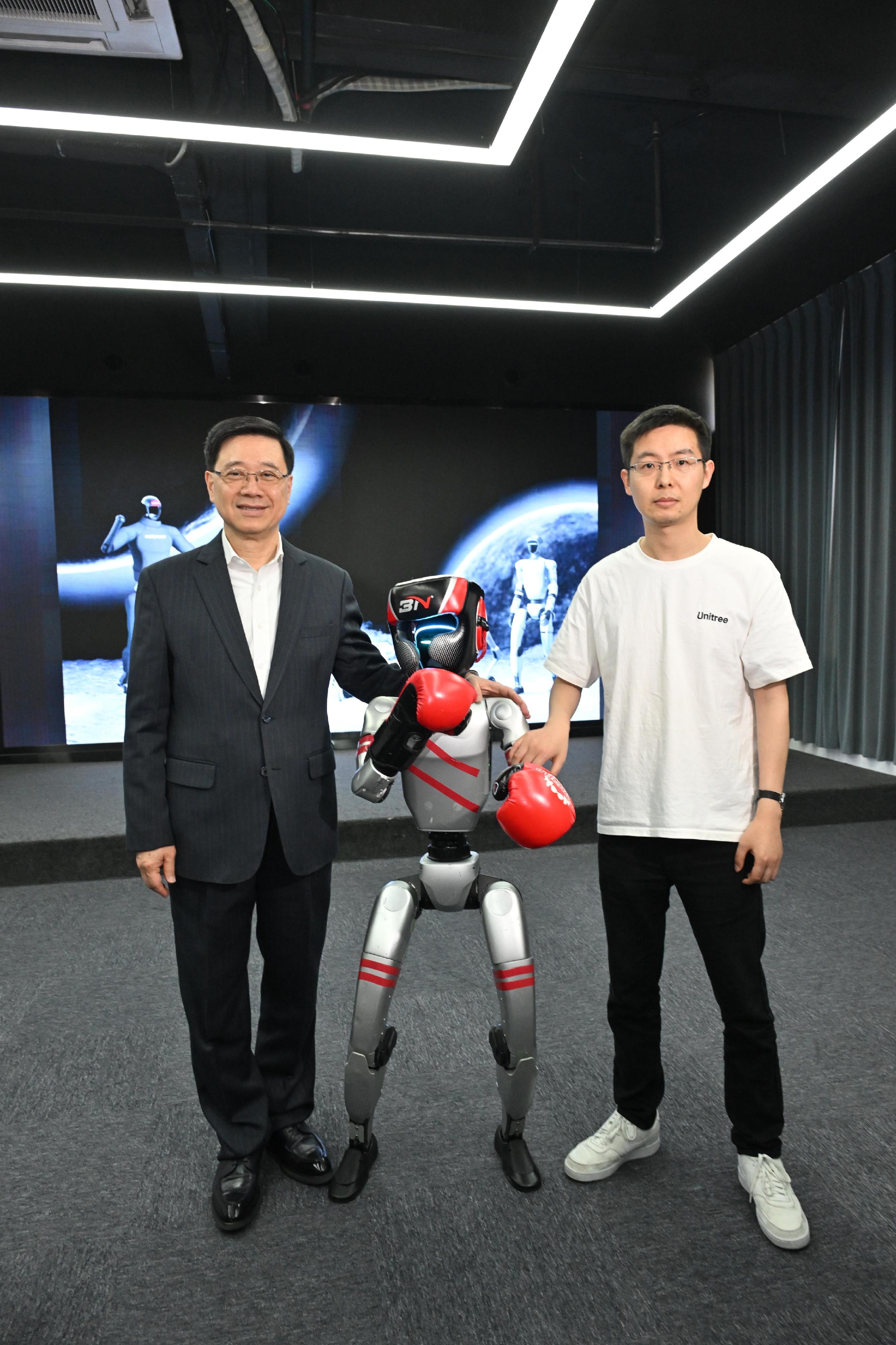 The Chief Executive, Mr John Lee, continued his visit to Hangzhou today (April 23). Photo shows Mr Lee (left) visiting Hangzhou Yushu Technology Co Ltd.

