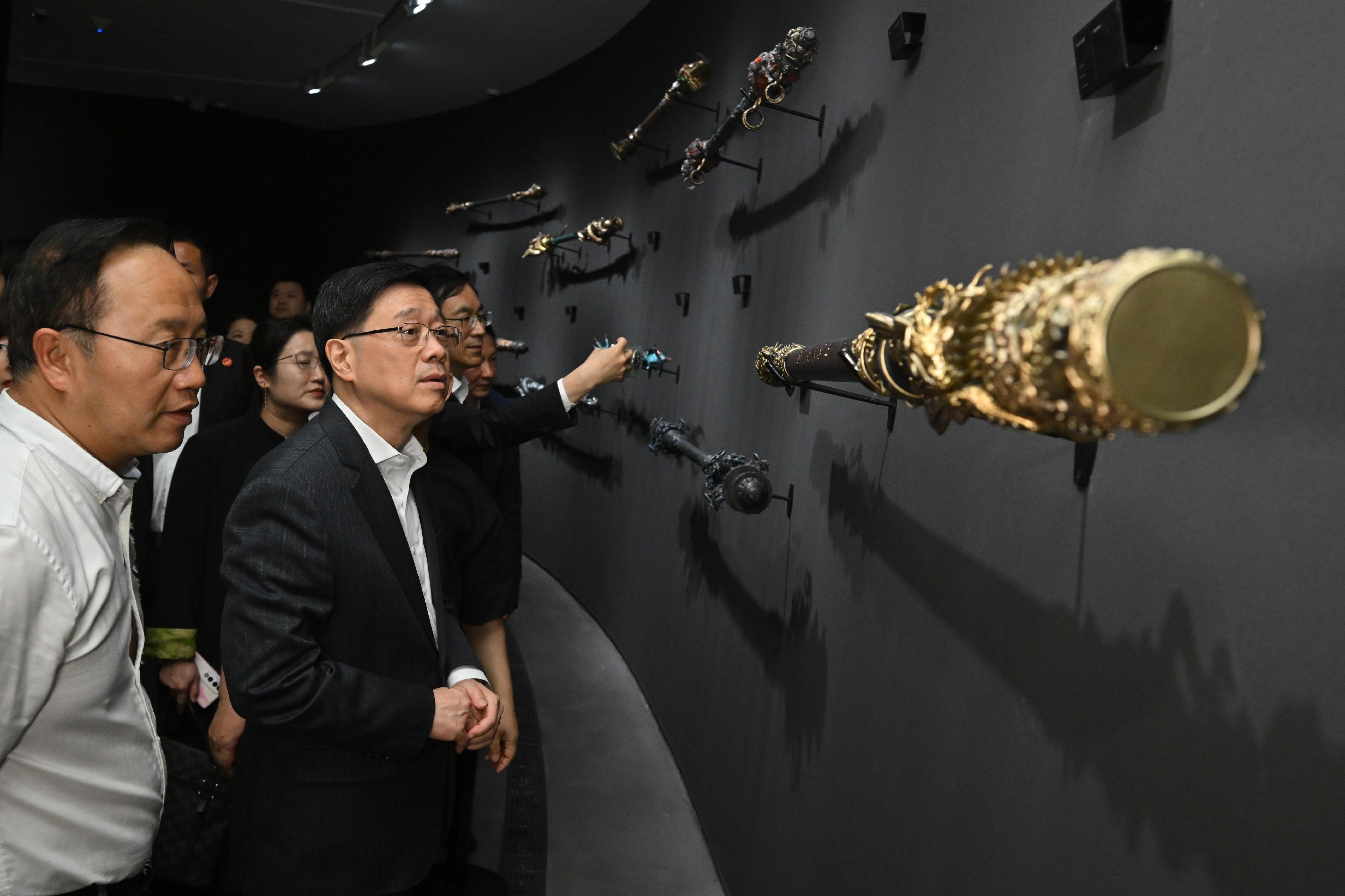 The Chief Executive, Mr John Lee, continued his visit to Hangzhou today (April 23). Photo shows Mr Lee (second left) visiting Black Myth: Wukong Art Exhibition.