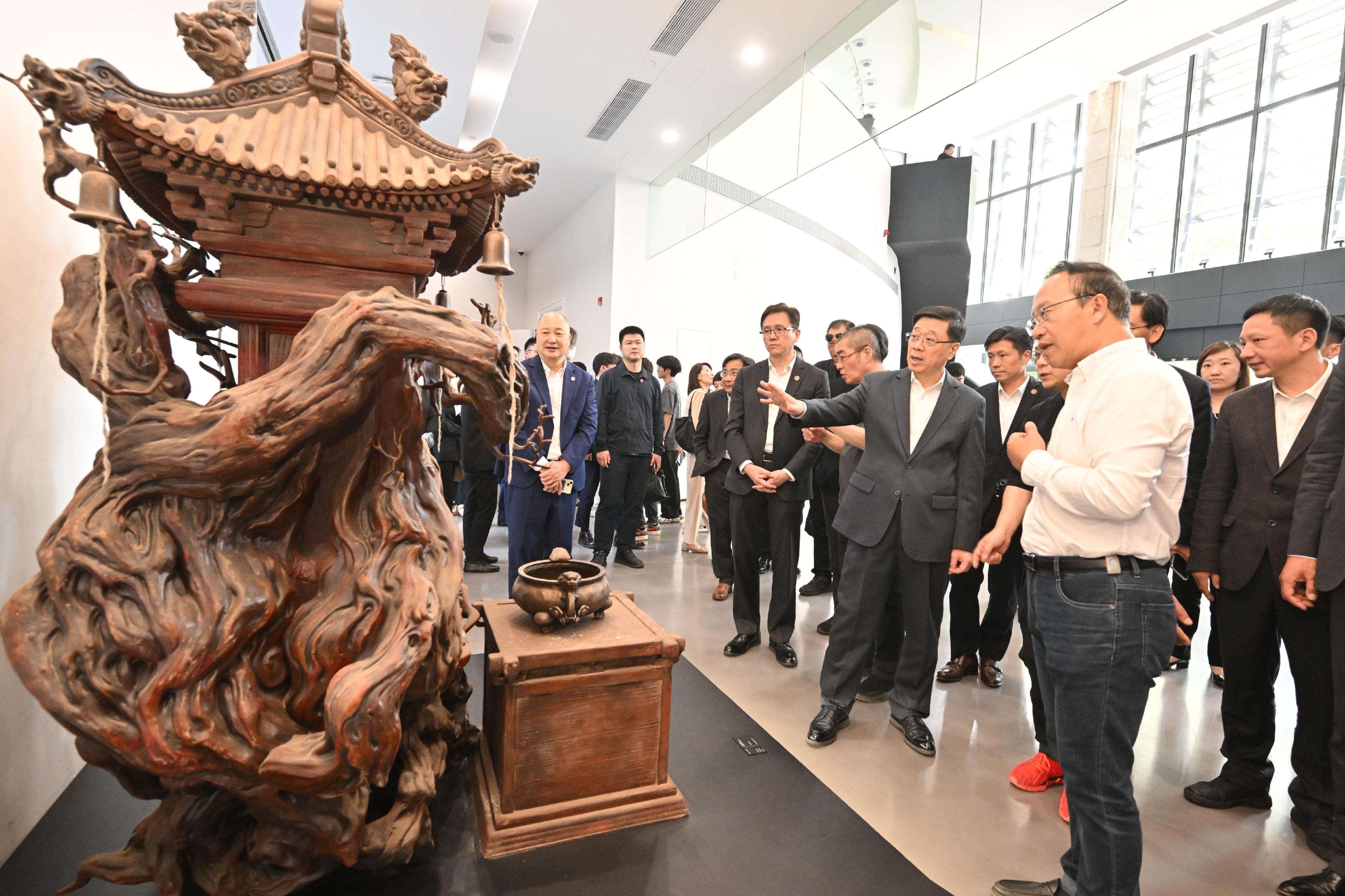 The Chief Executive, Mr John Lee, continued his visit to Hangzhou today (April 23). Photo shows Mr Lee (third right) visiting Black Myth: Wukong Art Exhibition.