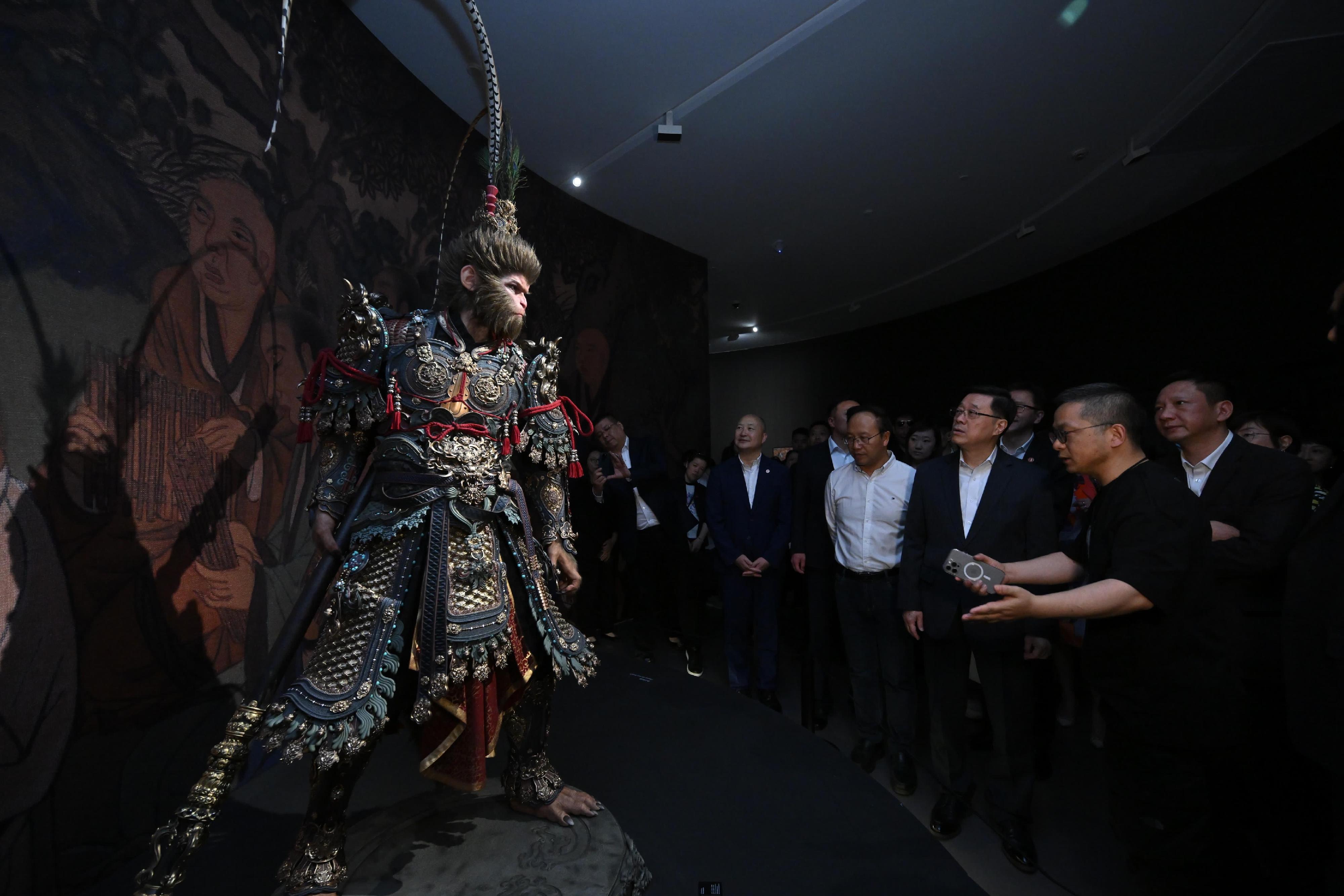 The Chief Executive, Mr John Lee, continued his visit to Hangzhou today (April 23). Photo shows Mr Lee (third right) visiting Black Myth: Wukong Art Exhibition.
