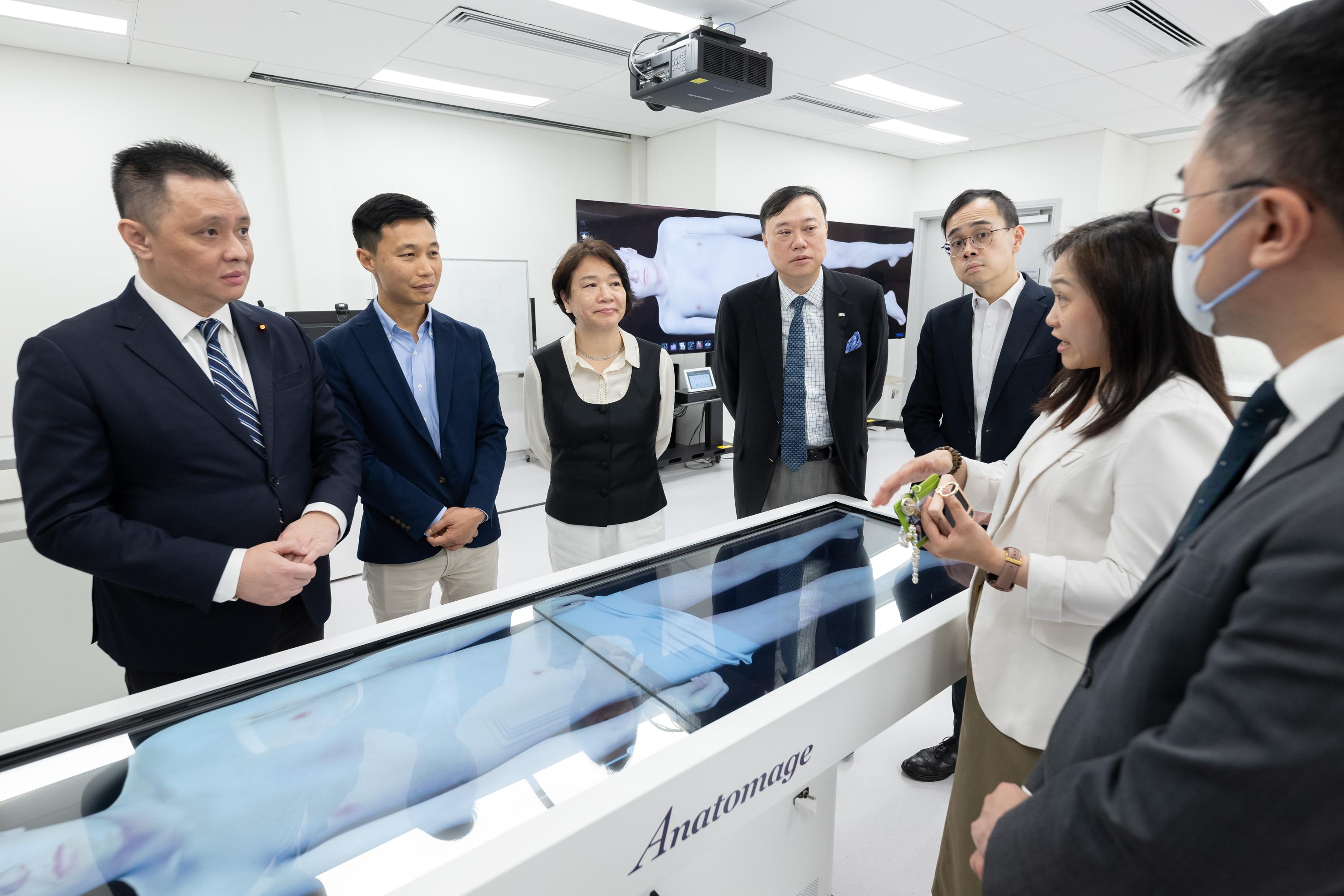 The Legislative Council (LegCo) Subcommittee on Promoting the Development of Hong Kong into an International Education Hub visits Hong Kong Metropolitan University (HKMU) today (April 23) to learn about the important role played by vocational and professional education and training in developing Hong Kong into an international post-secondary education hub. The Chairman of the Subcommittee on Promoting the Development of Hong Kong into an International Education Hub, Mr Tang Fei (first left), and other LegCo Members visited the Jockey Club Institute of Healthcare of the HKMU.
