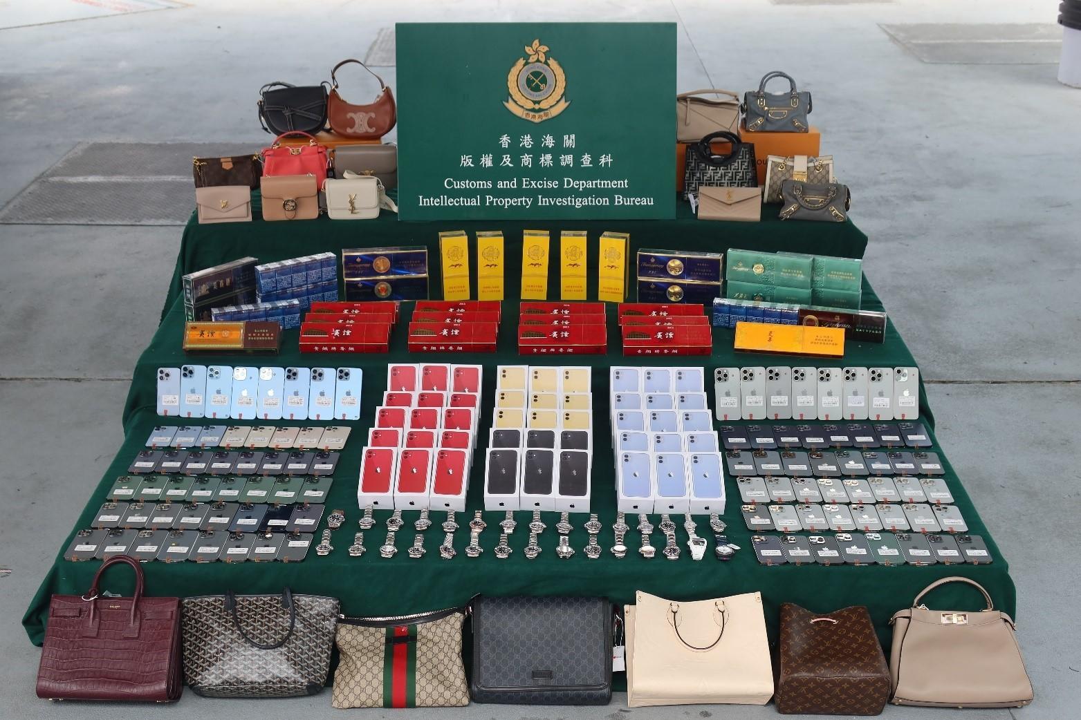 Hong Kong Customs on March 24 seized about 1 400 suspected counterfeit goods and about 10 000 suspected illicit cigarettes with a total estimated market value of about $1.3 million at the Hong Kong-Zhuhai-Macao Bridge Hong Kong Port. Photo shows the suspected counterfeit goods and suspected illicit cigarettes seized. 