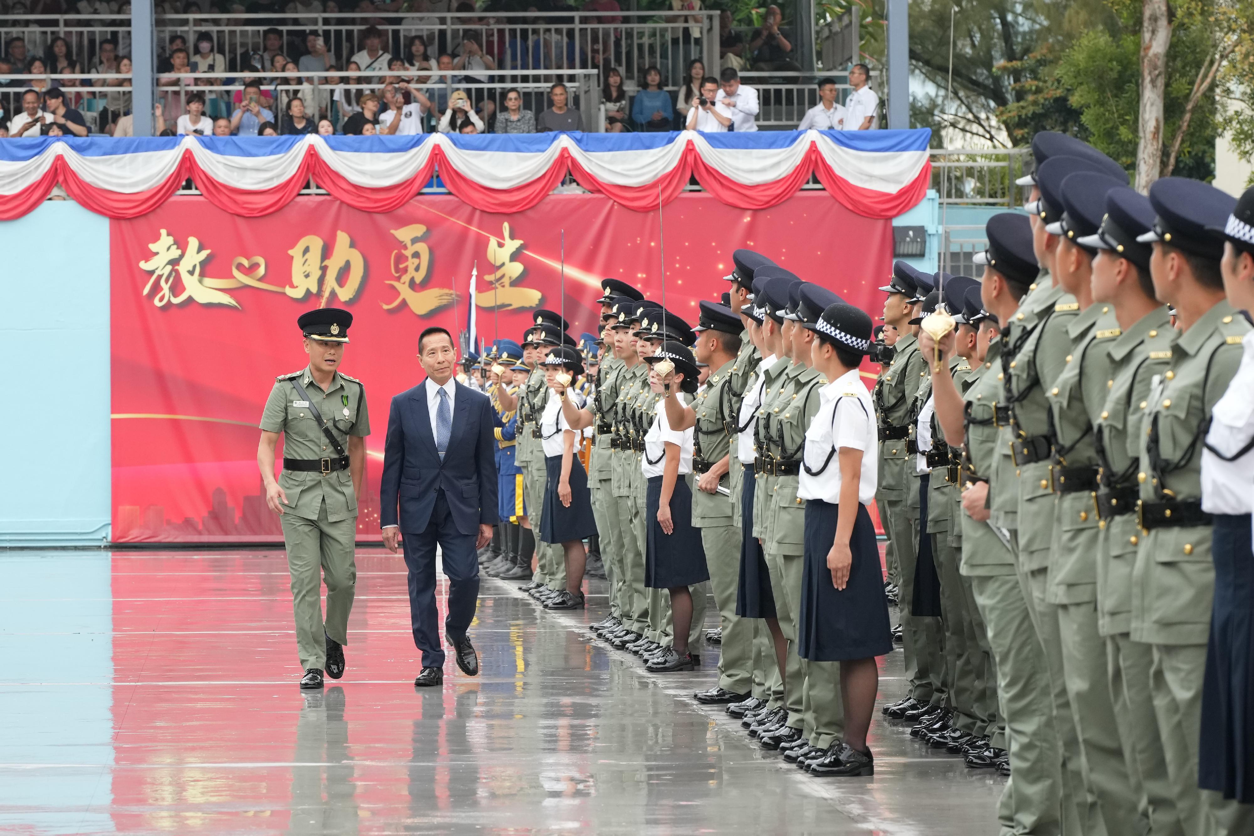 The Correctional Services Department held a passing-out parade at the Hong Kong Correctional Services Academy today (April 25). Photo shows Reviewing Officer Mr Richard Tang (second left) inspecting a contingent of graduates.