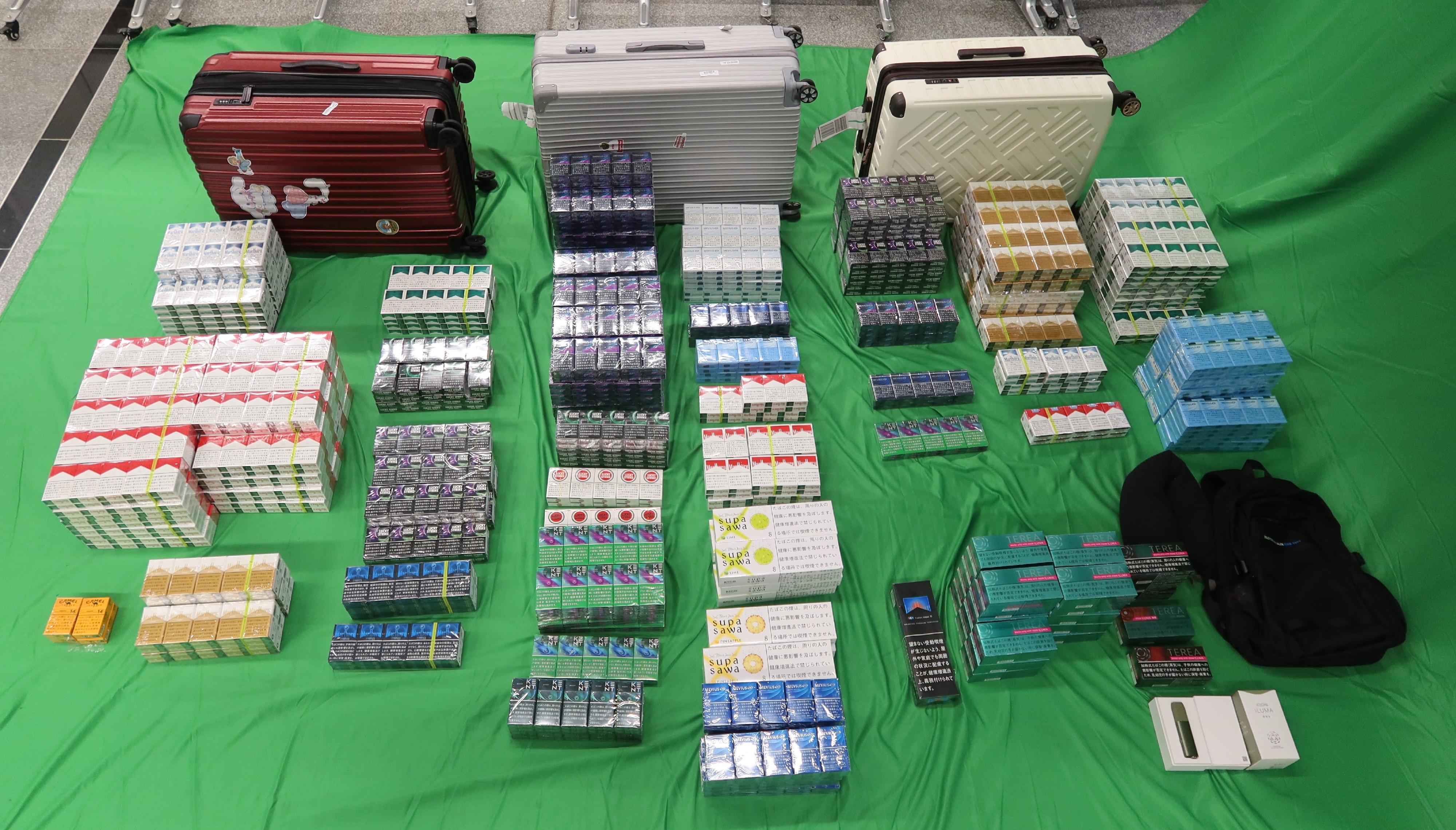 An incoming 40-year-old female passenger was sentenced to four months' imprisonment and fined $1,000 at the West Kowloon Magistrates' Courts today (April 25) for possessing duty-not-paid cigarettes and failing to declare to Customs officers, as well as for importing alternative smoking products, in contravention of the Dutiable Commodities Ordinance and the Import and Export Ordinance. Photo shows the duty-not-paid cigarettes and alternative smoking products seized.