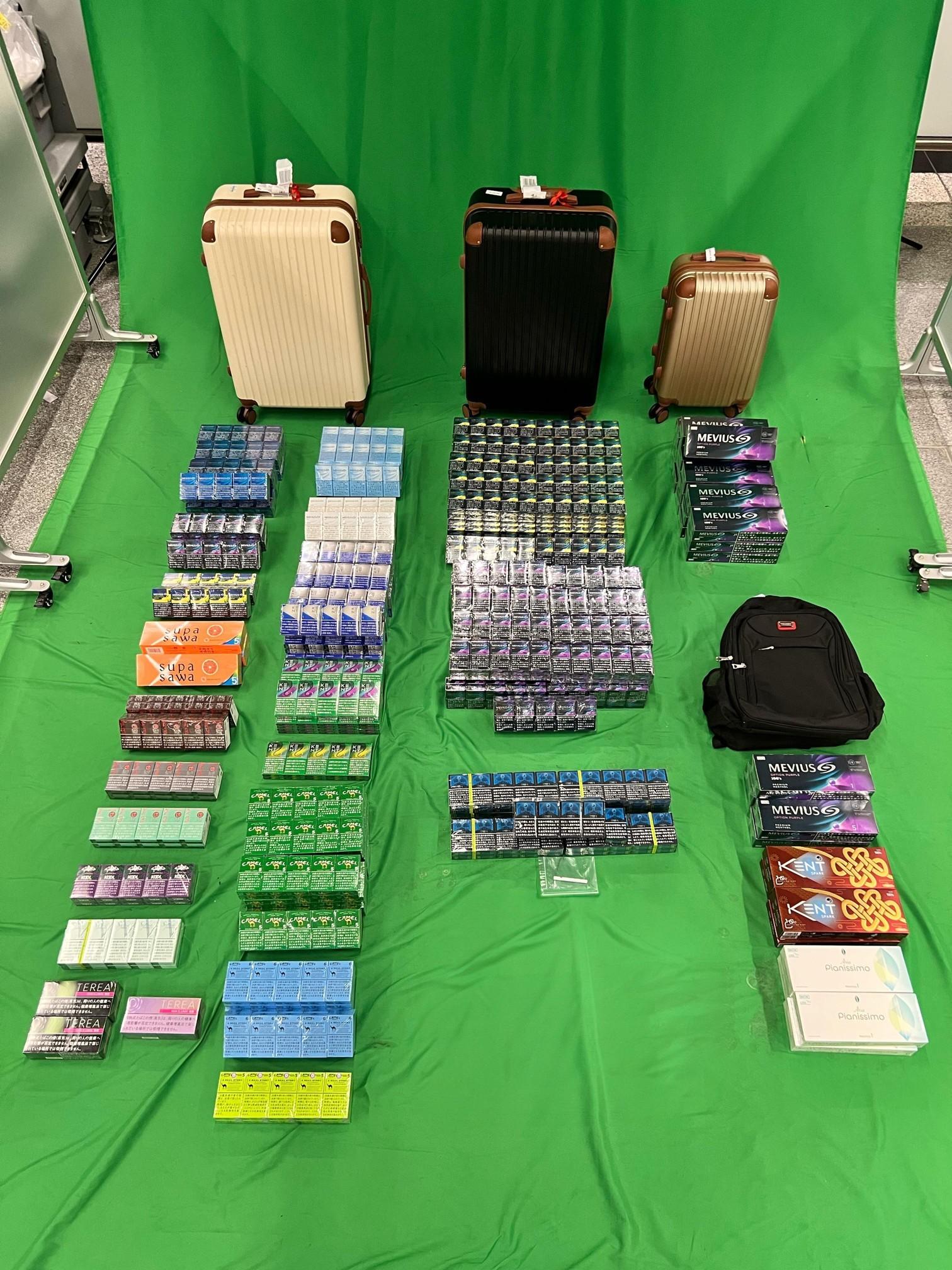 An incoming 30-year-old female passenger was sentenced to four months' imprisonment and fined $500 at the West Kowloon Magistrates' Courts today (April 25) for possessing duty-not-paid cigarettes and failing to declare to Customs Officers, as well as for importing alternative smoking products, in contravention of the Dutiable Commodities Ordinance and the Import and Export Ordinance. Photo shows the duty-not-paid cigarettes and alternative smoking products seized.