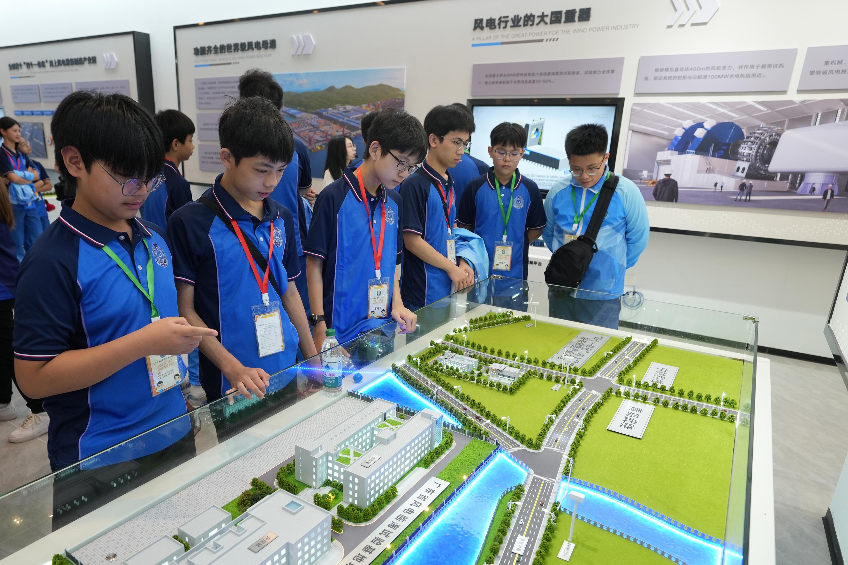 The Immigration Department Youth Leaders Corps (IDYL) organised the three-day National Games in Touch: Chaoshan Exchange Tour from April 22 to 24. Photo shows IDYL members visiting Shantou Offshore Wind Power Industrial Park to learn about the key national strategy on wind energy projects.