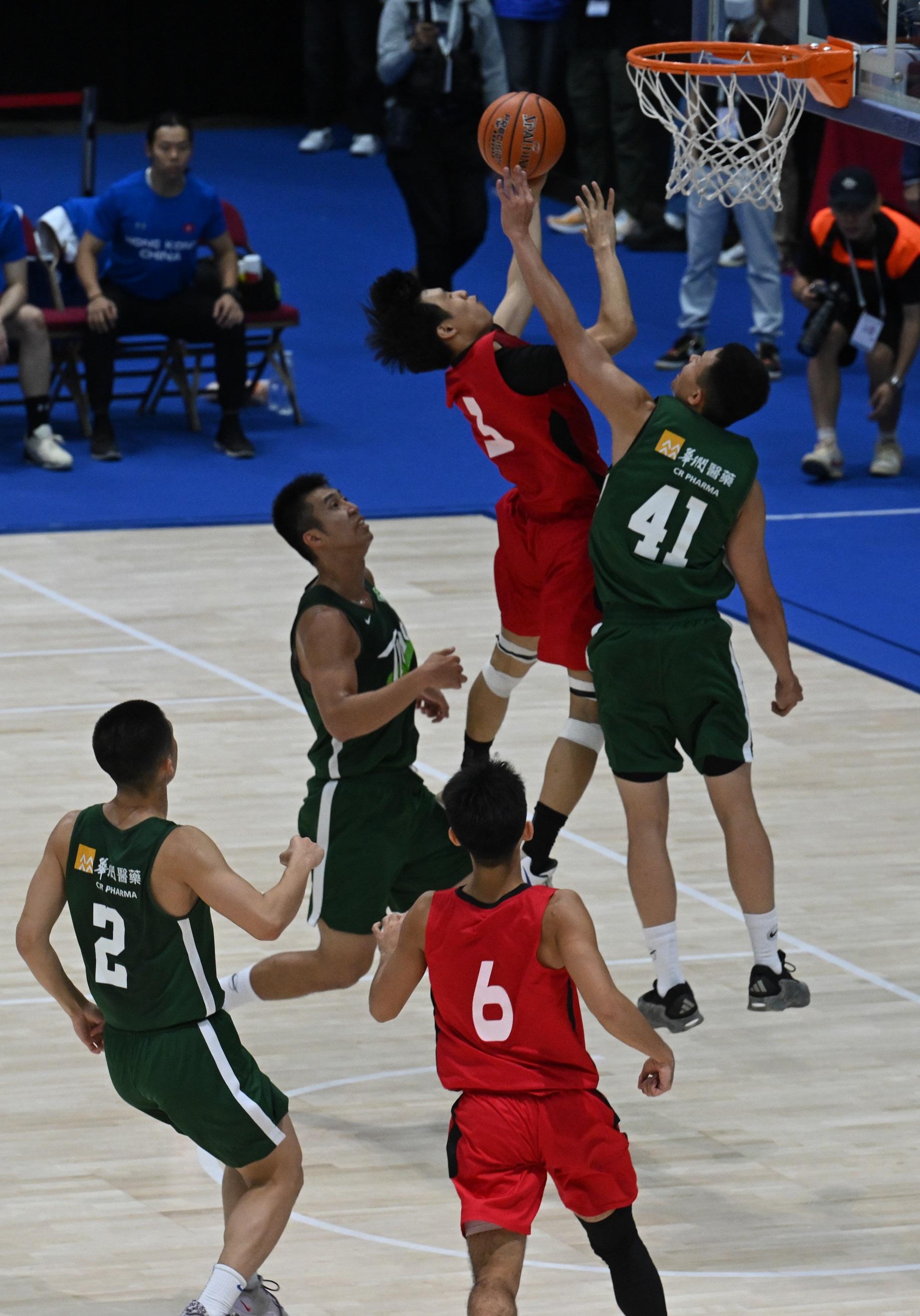 The 15th National Games Basketball (Men's U22) test event concluded at the Hong Kong Coliseum in Hung Hom today (April 27). Photos shows Hong Kong A1 Division Championship basketball team Tycoon competing with the Hong Kong Men's U22 representative team at the event.