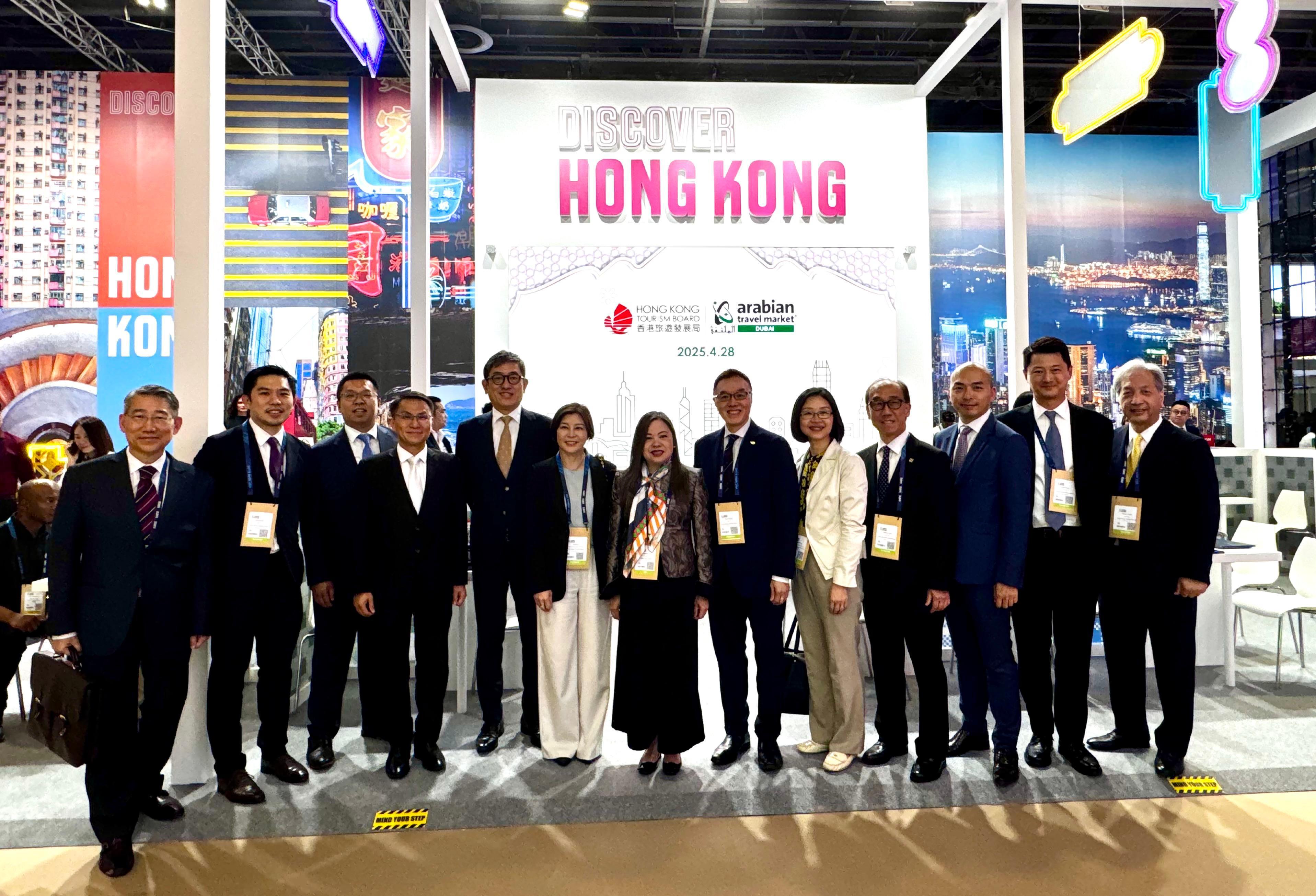 The Secretary for Culture, Sports and Tourism, Miss Rosanna Law, started her visit to Dubai, the United Arab Emirates (UAE) yesterday (April 28, Dubai time) and attended the Arabian Travel Market 2025, a leading international event for the Middle East's hospitality industry in the afternoon. She toured various pavilions, engaged with local trade representatives, and explored potential collaborations between Hong Kong’s tourism sector and the UAE market. Photo shows Miss Law (centre), the Deputy Commissioner for Tourism, Ms Joanne Chu (fifth right), and the Director-General of the Dubai Economic and Trade Offices, Mr Simon Chan (first left), pictured with trade representatives from Hong Kong at the Hong Kong Pavilion.