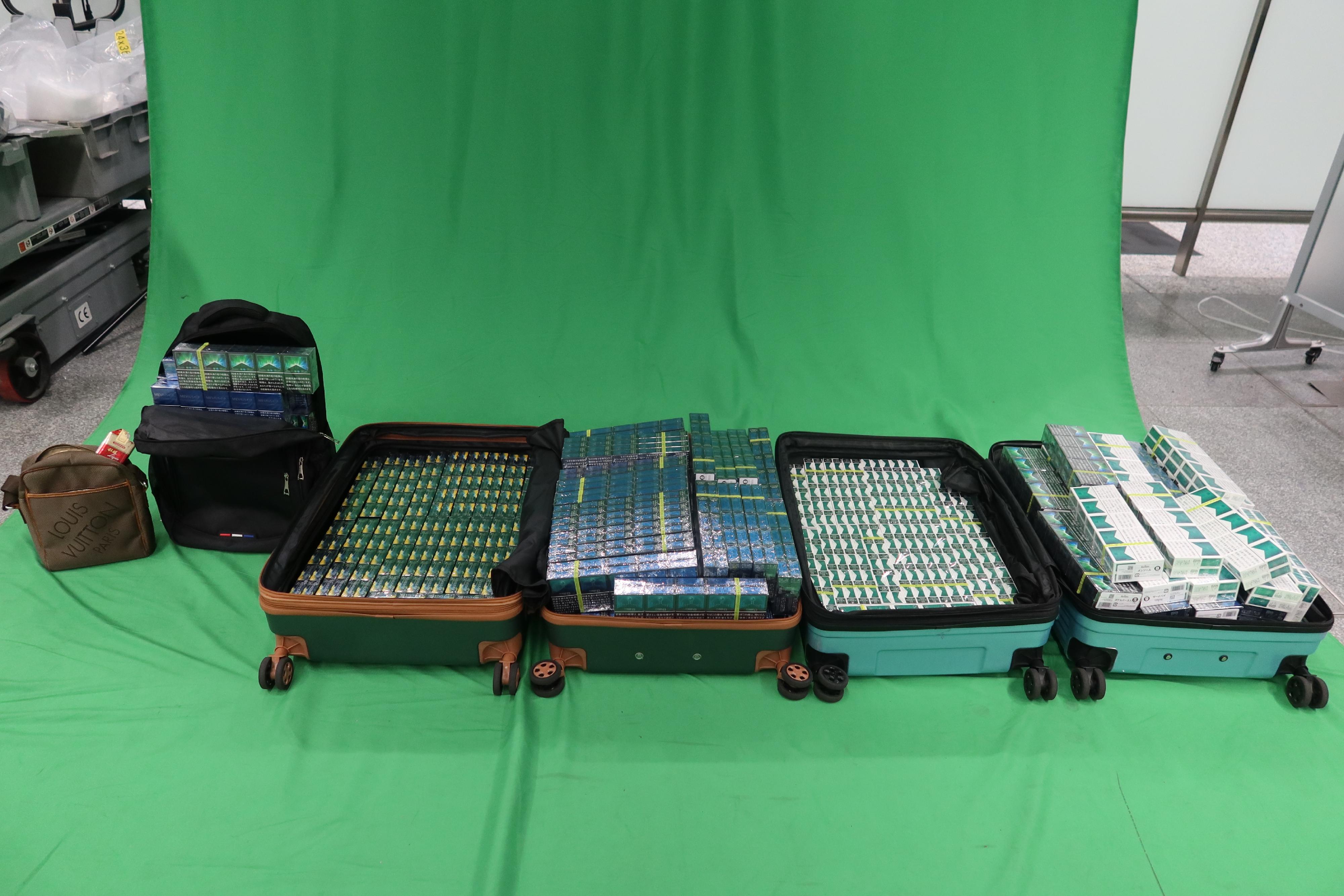 Two incoming male passengers, aged 28 and 37, were sentenced to six months' imprisonment and fined $500 at the West Kowloon Magistrates' Courts yesterday (April 28) for importing duty-not-paid cigarettes and failing to declare to Customs officers, in contravention of the Dutiable Commodities Ordinance. Photo shows the duty-not-paid cigarettes seized.

