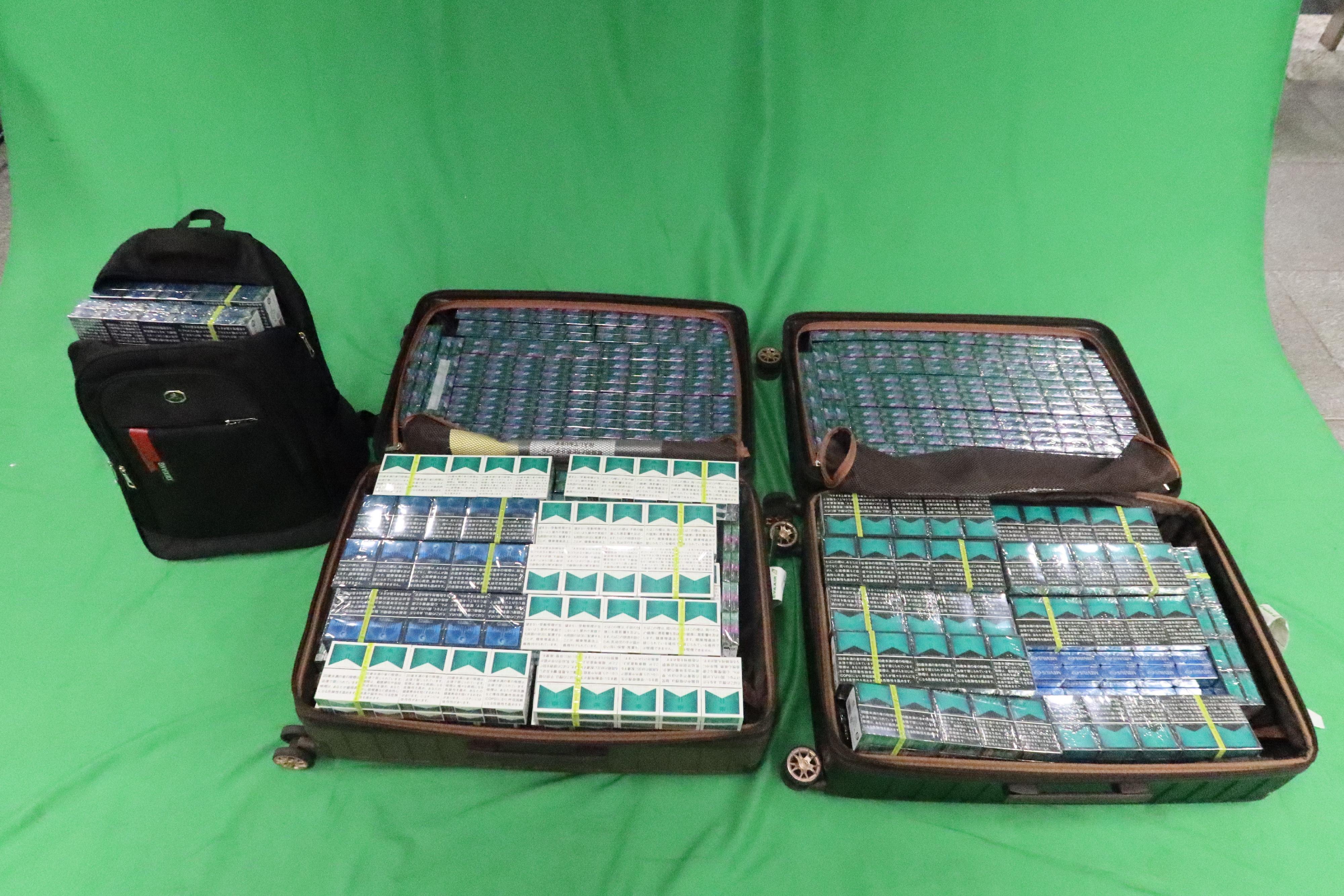 Two incoming male passengers, aged 28 and 37, were sentenced to six months' imprisonment and fined $500 at the West Kowloon Magistrates' Courts yesterday (April 28) for importing duty-not-paid cigarettes and failing to declare to Customs officers, in contravention of the Dutiable Commodities Ordinance. Photo shows the duty-not-paid cigarettes seized.

