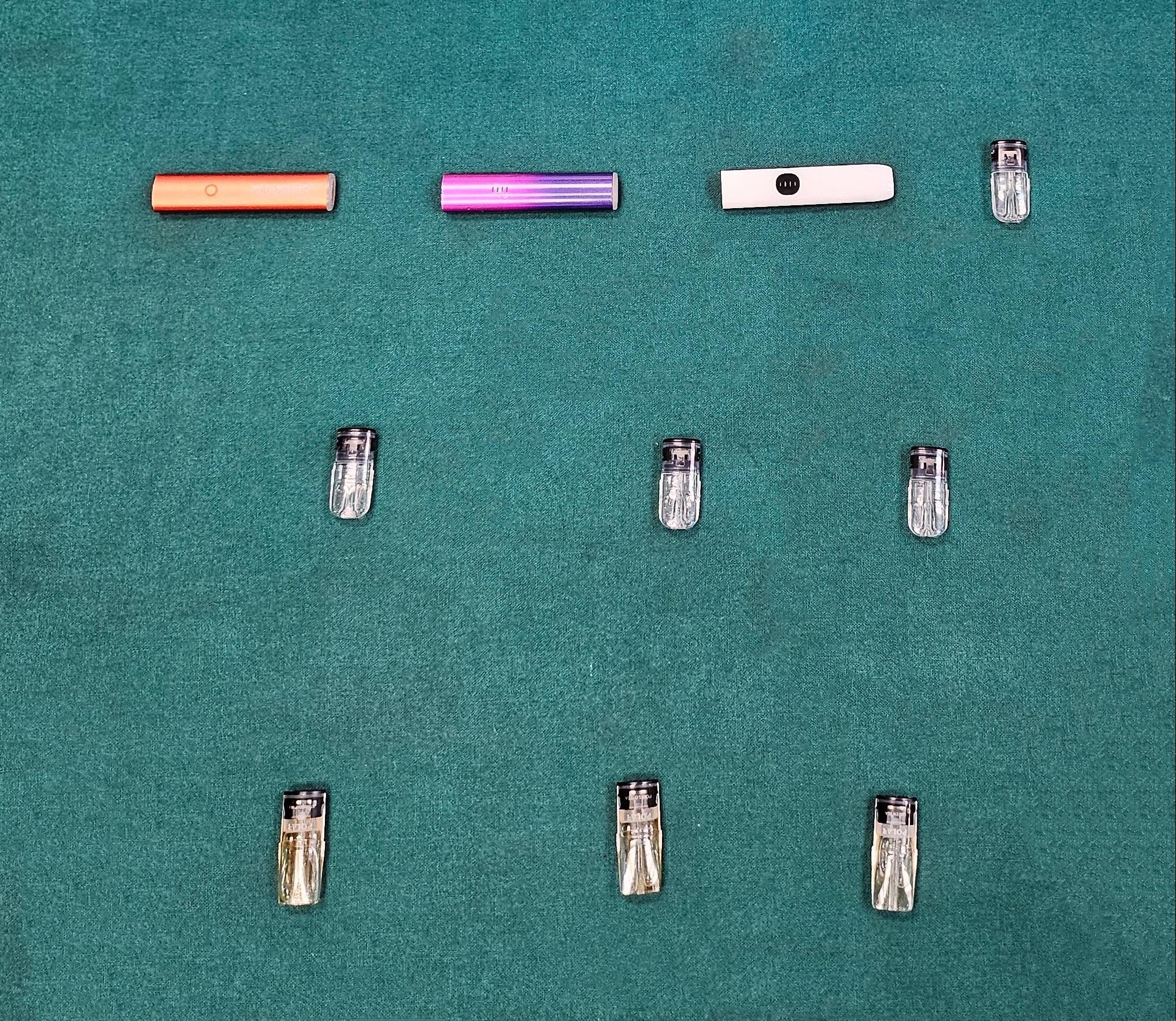 Hong Kong Customs yesterday (April 30) detected a case involving possession of etomidate, the main ingredient of the "space oil drug", which is under the Dangerous Drug Ordinance, by an incoming passenger at the Lok Ma Chau Control Point. Seven suspected "space oil drug" capsules and three vape sticks were seized.  Photo shows the suspected "space oil drug" capsules and the vape sticks seized.