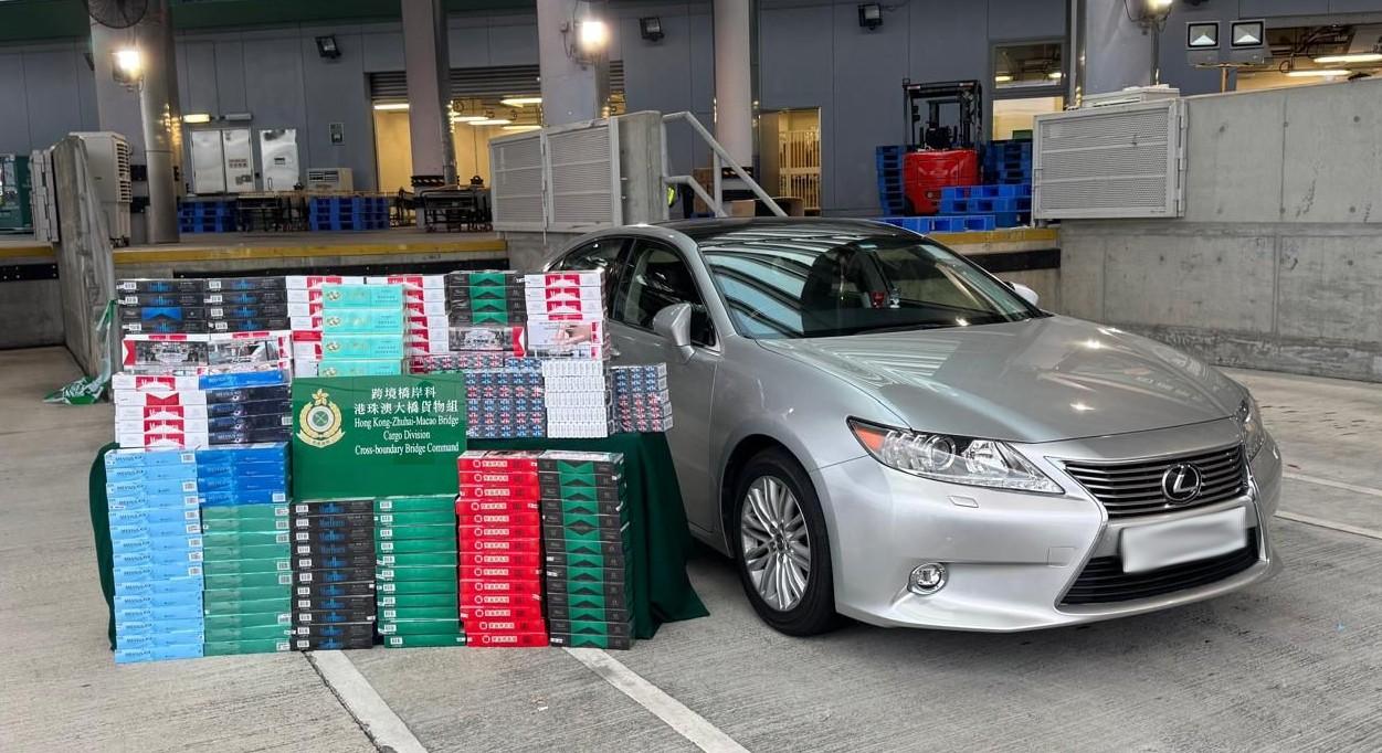 A 43-year-old incoming male driver was sentenced to five months' imprisonment and fined $1,000 at the West Kowloon Magistrates' Courts today (May 2) for importing duty-not-paid cigarettes and failing to declare to Customs Officers, in contravention of the Dutiable Commodities Ordinance. Photo shows the duty-not-paid cigarettes seized and the private car concerned in the case.