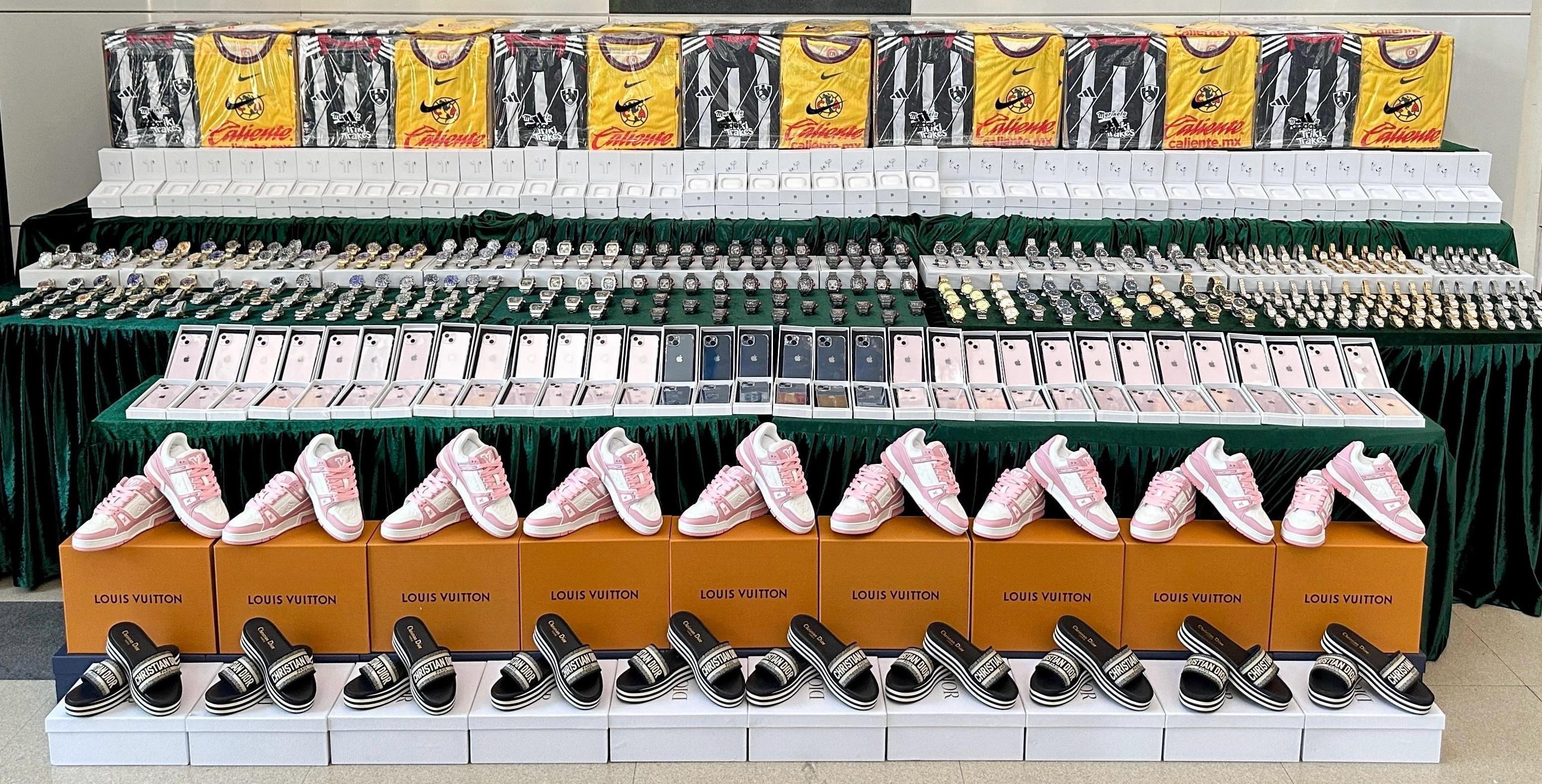 Hong Kong Customs conducted a two-week enforcement operation with the Mainland and Macao Customs from April 14 to 26, during which inspections of goods across the three places and destined for America, Europe, and countries and regions along the Belt and Road Initiative were stepped up, with a view to combating cross-boundary and transshipment counterfeiting activities. During the operation, Hong Kong Customs detected 15 cases and seized about 70 000 suspected counterfeit goods, including watches, mobile phones and accessories, earphones, jerseys and footwear, with a total estimated market value of about $41 million. Photo shows some of the suspected counterfeit goods seized. 
