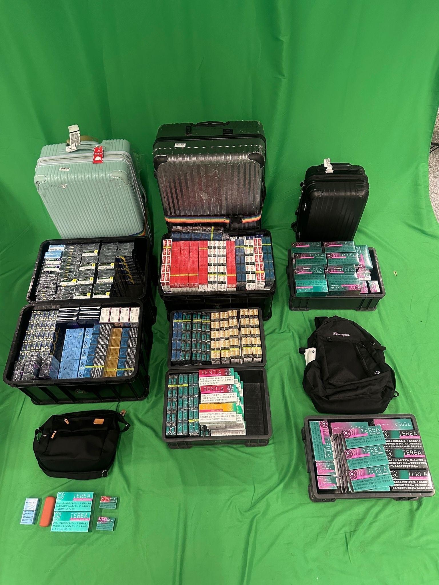An incoming 43-year-old male passenger was sentenced to four months' imprisonment and fined $1,000 at the West Kowloon Magistrates' Courts today (May 2) for possessing duty-not-paid cigarettes and failing to declare to Customs Officers, as well as for importing alternative smoking products, in contravention of the Dutiable Commodities Ordinance and the Import and Export Ordinance. Photo shows the duty-not-paid cigarettes and alternative smoking products seized.