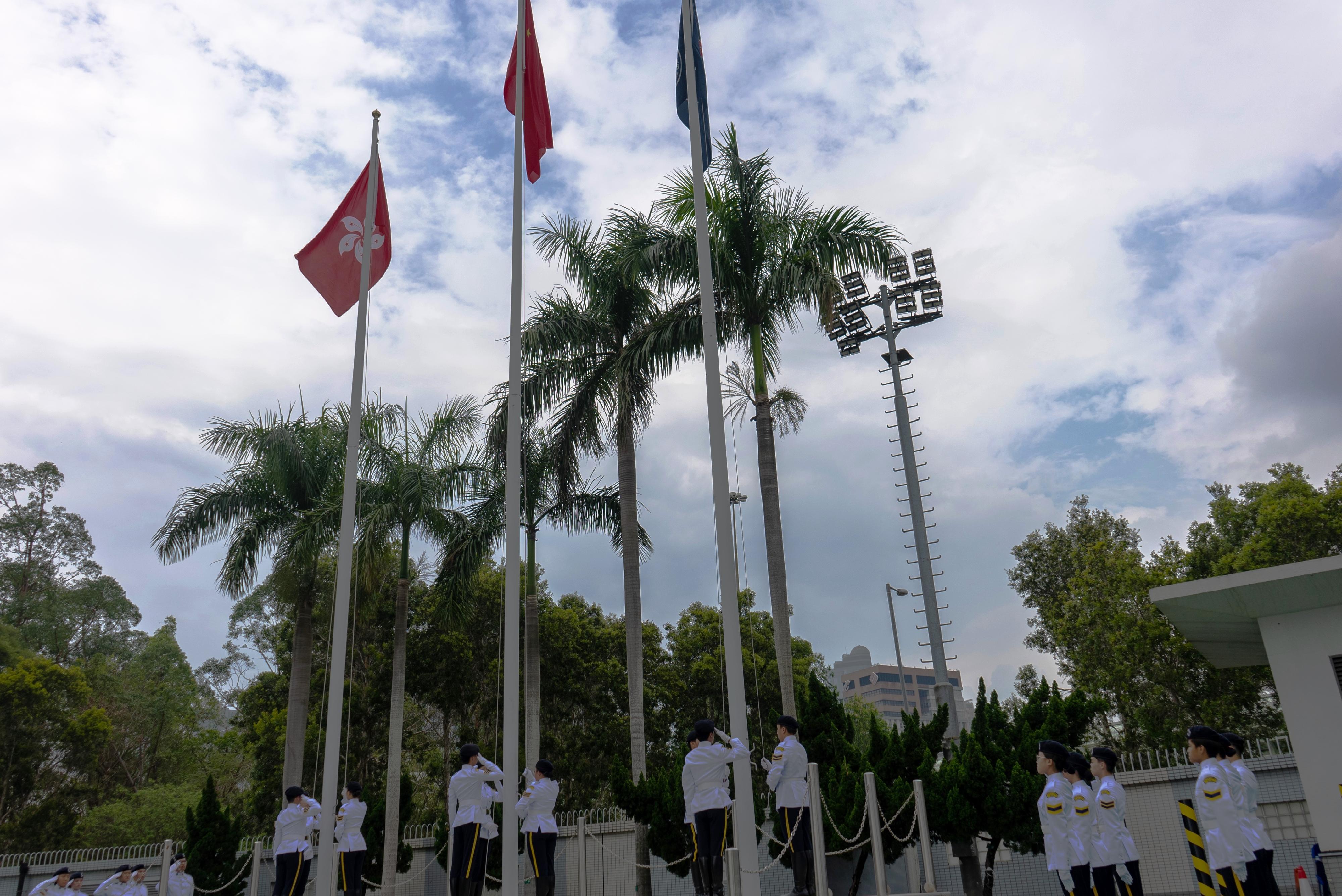 The Civil Aid Service Cadet Corps held the 147th New Cadets Passing-out Parade today (May 3). Photo shows the Cadet Corps Guard of Honour performing a flag-raising ceremony.