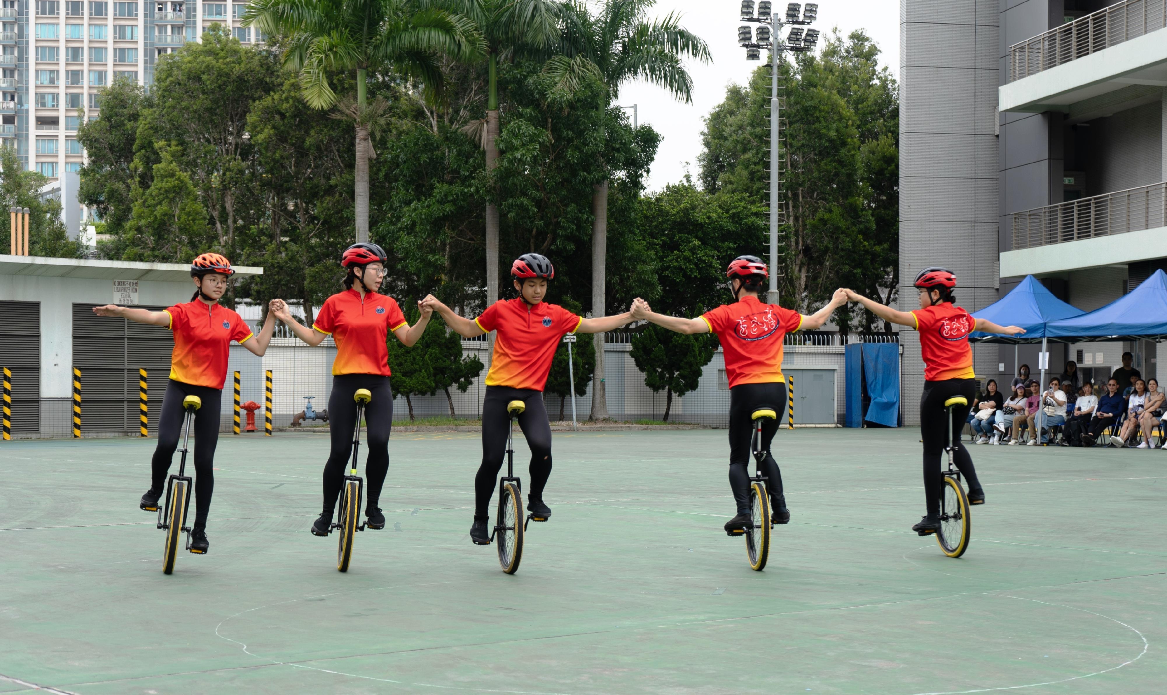 The Civil Aid Service (CAS) Cadet Corps held the 147th New Cadets Passing-out Parade today (May 3). Photo shows the CAS Cadet Corps Bicycle Demonstration Team performing.
