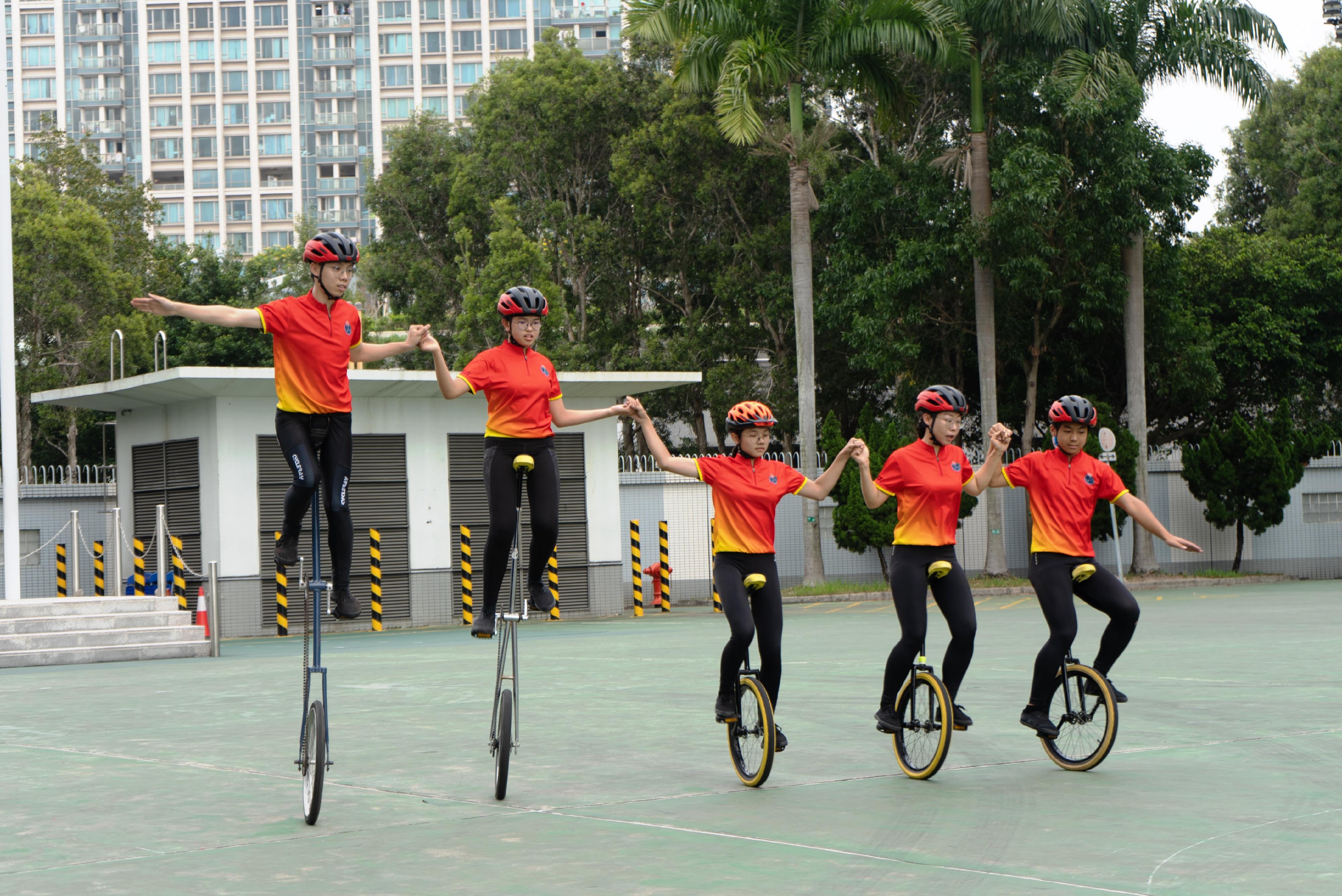 The Civil Aid Service (CAS) Cadet Corps held the 147th New Cadets Passing-out Parade today (May 3). Photo shows the CAS Cadet Corps Bicycle Demonstration Team performing.
