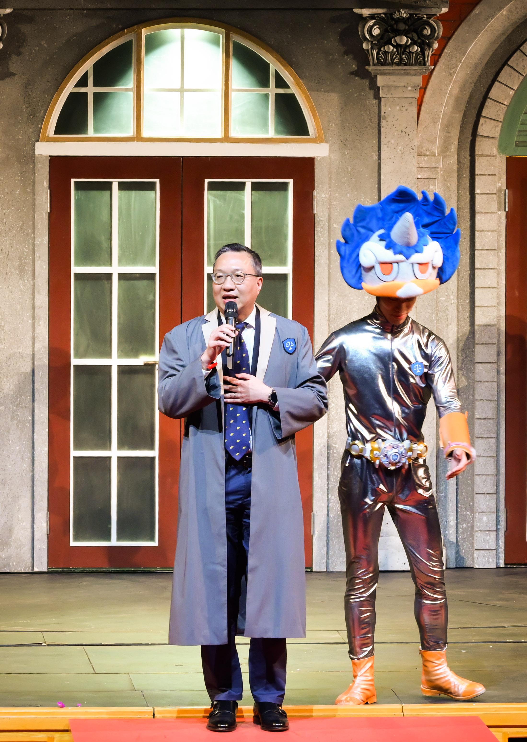 The Department of Justice held a large-scale Rule of Law Drama Day today (May 3) at the Grand Theatre of the Hong Kong Cultural Centre, presenting the drama "Rule of Law Academy - Adventure to the Stars" under the "Rule of Law through Drama" project. Photo shows the Secretary for Justice, Mr Paul Lam, SC (left), performing onstage.