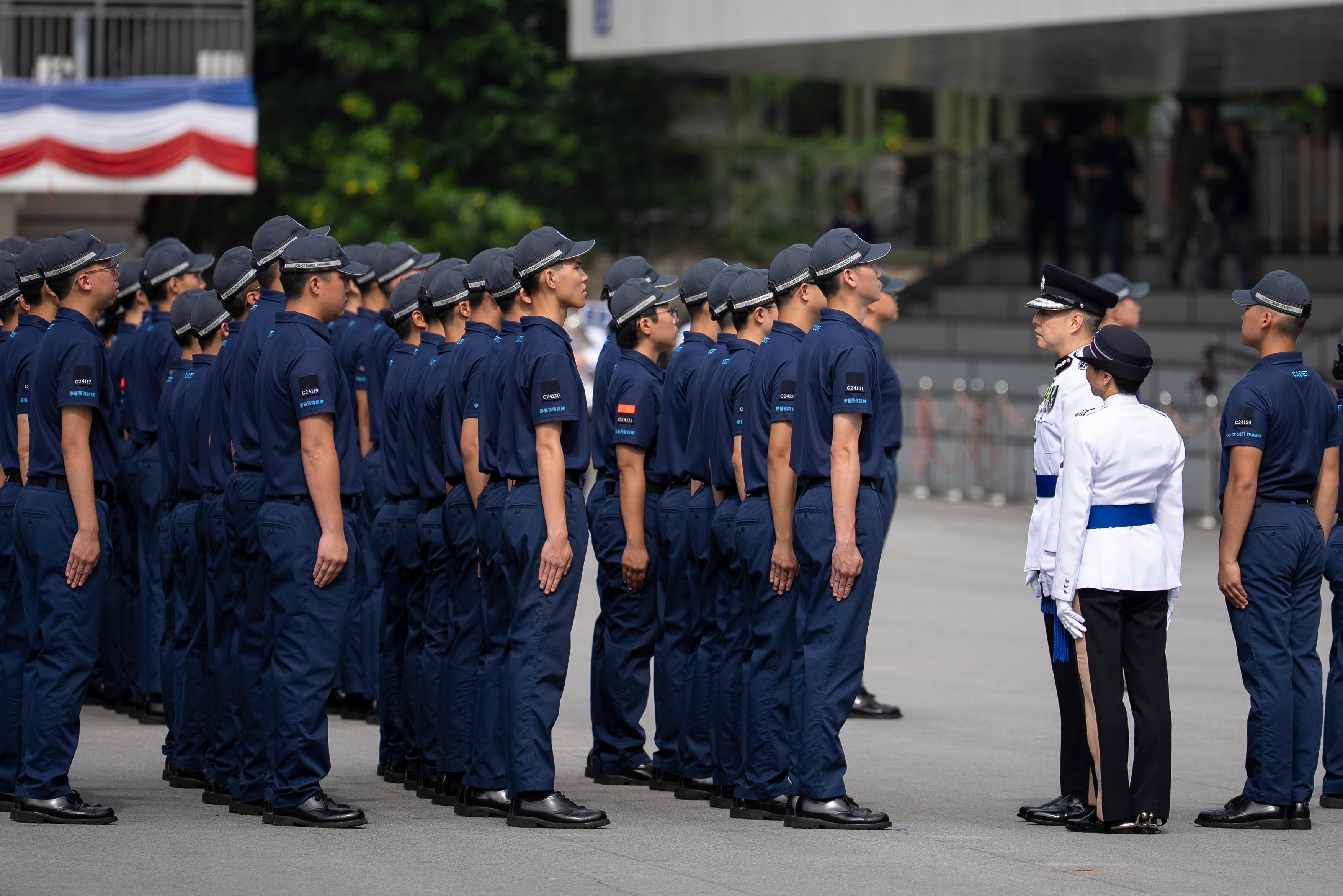The Commissioner of Police, Mr Chow Yat-ming, inspects a passing-out parade of the Police Cadet Training as Reviewing Officer today (May 3).