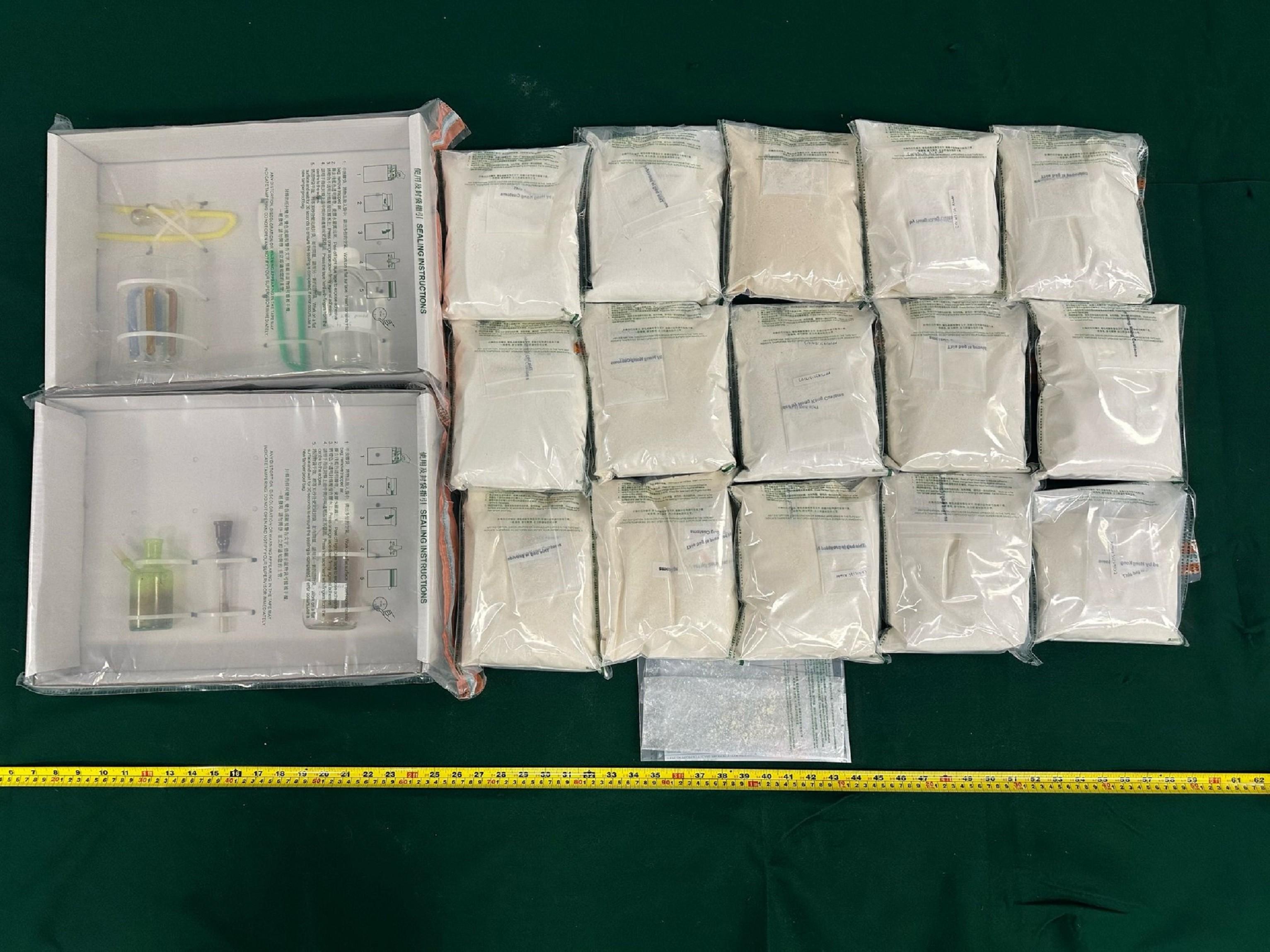 Hong Kong Customs yesterday (May3) seized about 15 kilograms of suspected etomidate and a batch of drug inhaling apparatus with an estimated market value of about $14 million in Tsuen Wan and Ngau Tau Kok. Photo shows the suspected etomidate and drug inhaling apparatus seized.