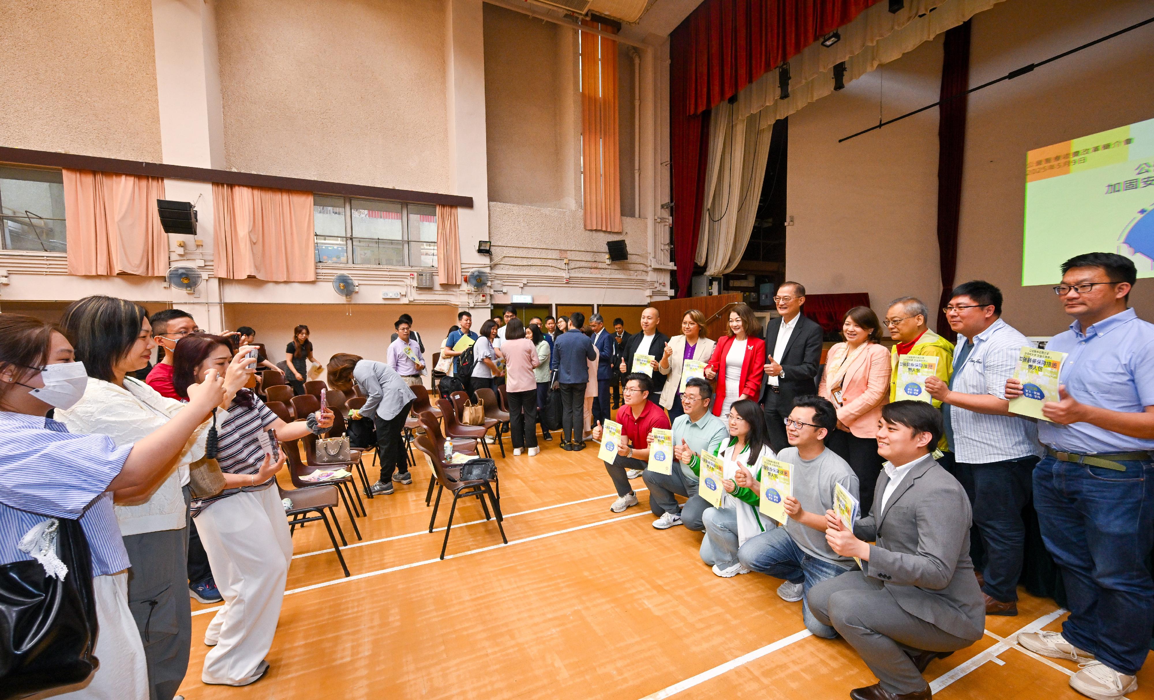 The Secretary for Health, Professor Lo Chung-mau, and the Under Secretary for Health, Dr Libby Lee, attended the second District Council briefing on the fees and charges reform for public healthcare today (May 9). Photo shows Professor Lo (back row, fifth right), Dr Lee (back row, fourth right) and other attendees of the briefing.