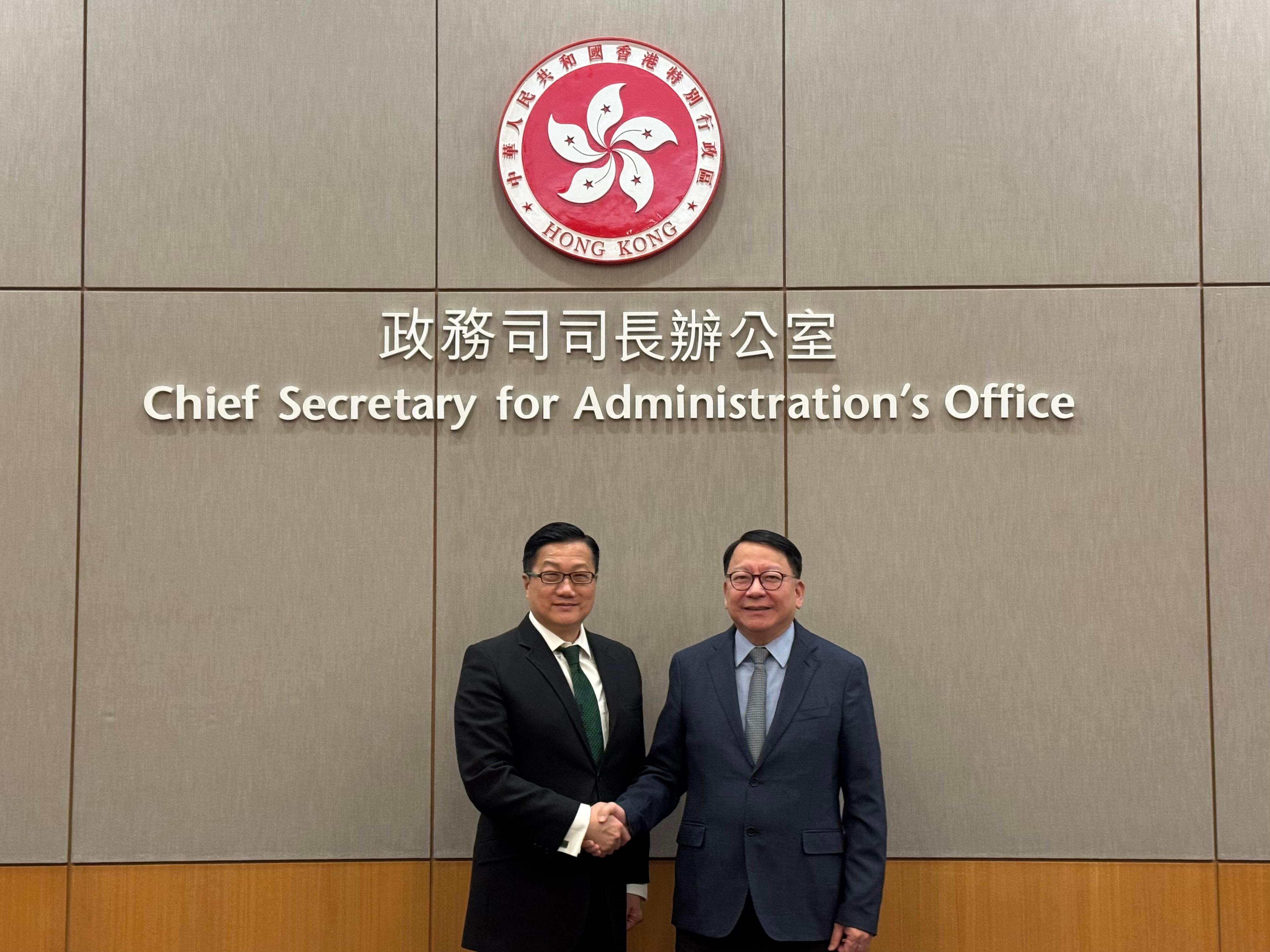 The Ombudsman, Mr Jack Chan (left) today (May 9) meets with the Chief Secretary for Administration, Mr Chan Kwok-ki (right).