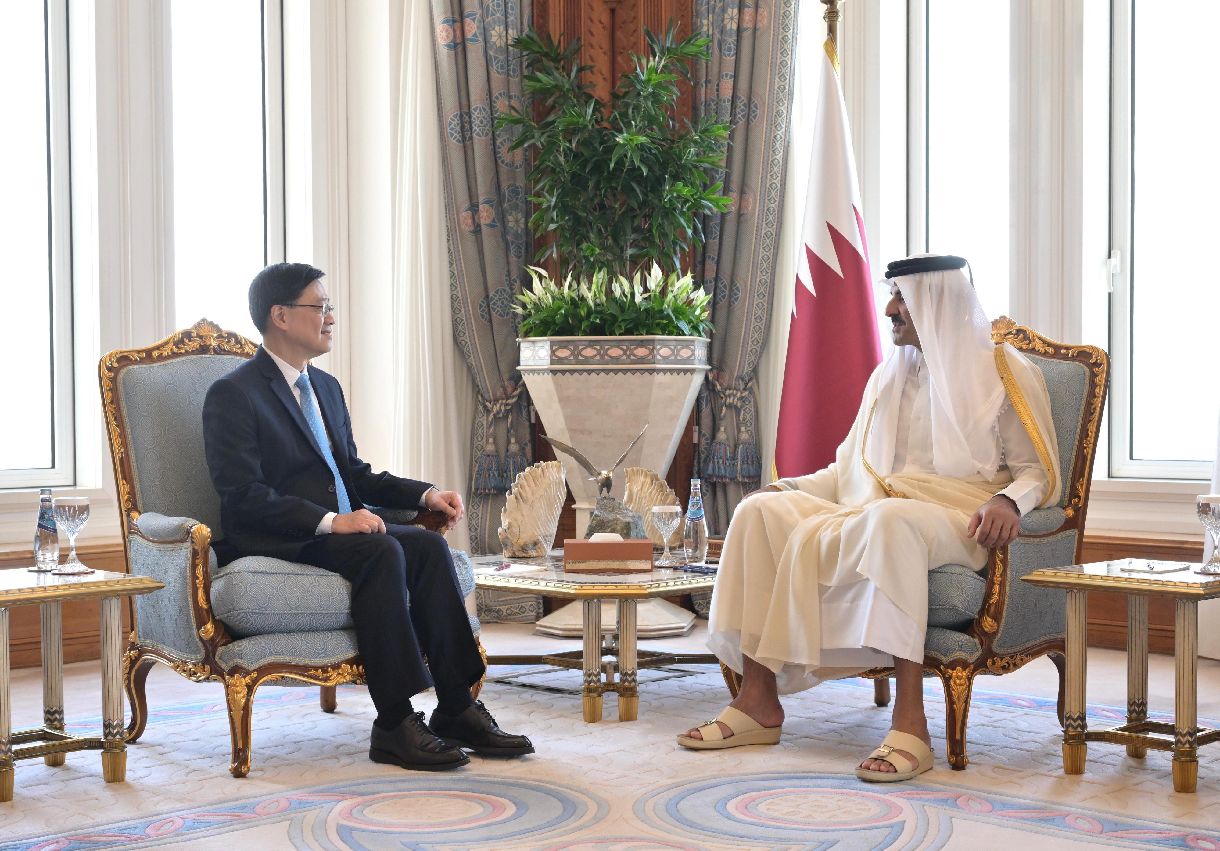 The Chief Executive, Mr John Lee (left), meets with the Amir (head of state) of Qatar, Mr Tamim bin Hamad Al Thani (right), in Qatar, today (May 11).