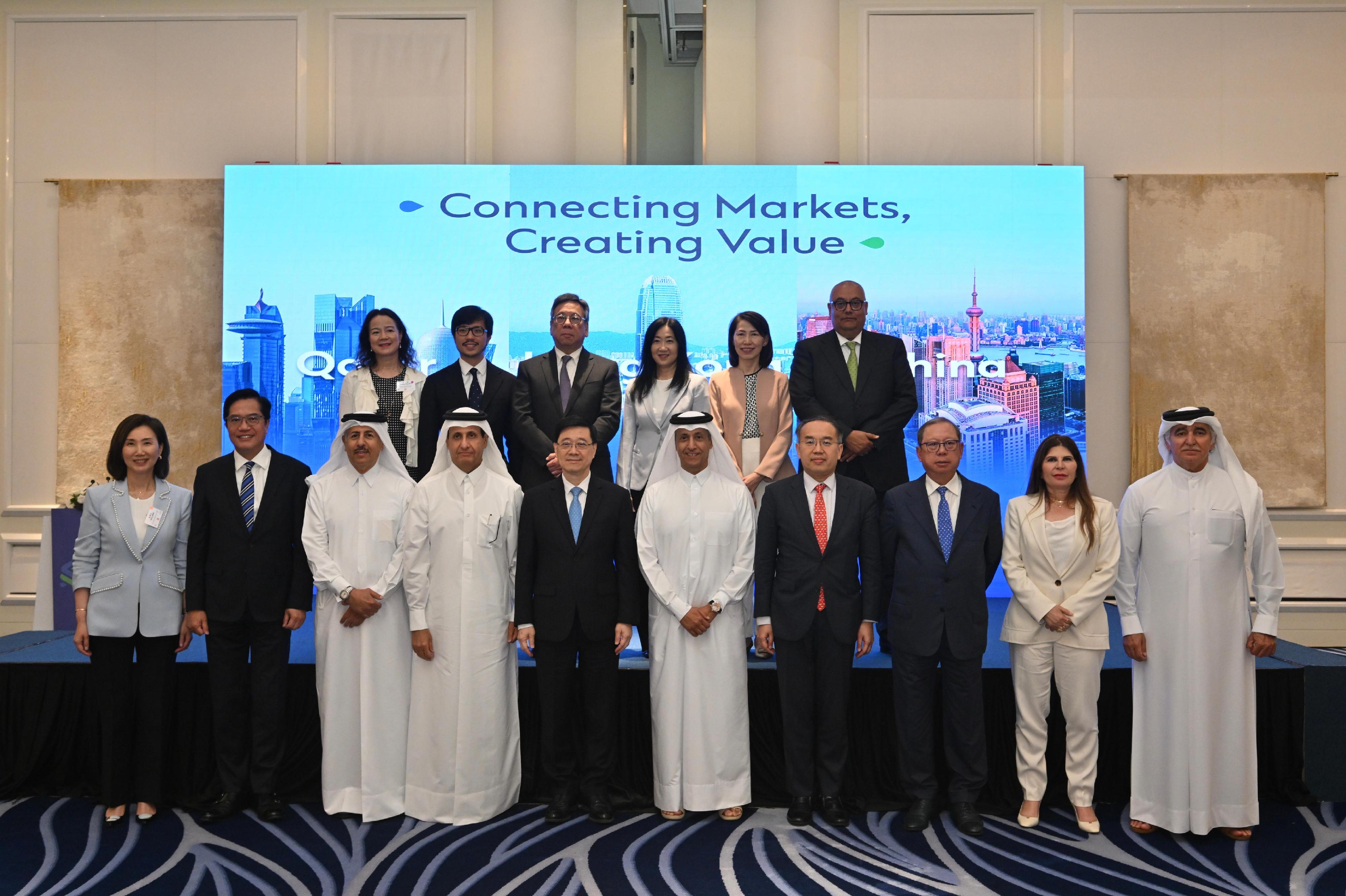 The Chief Executive, Mr John Lee (front row, fifth left), attends a luncheon hosted by an international financial group in Qatar, today (May 11).