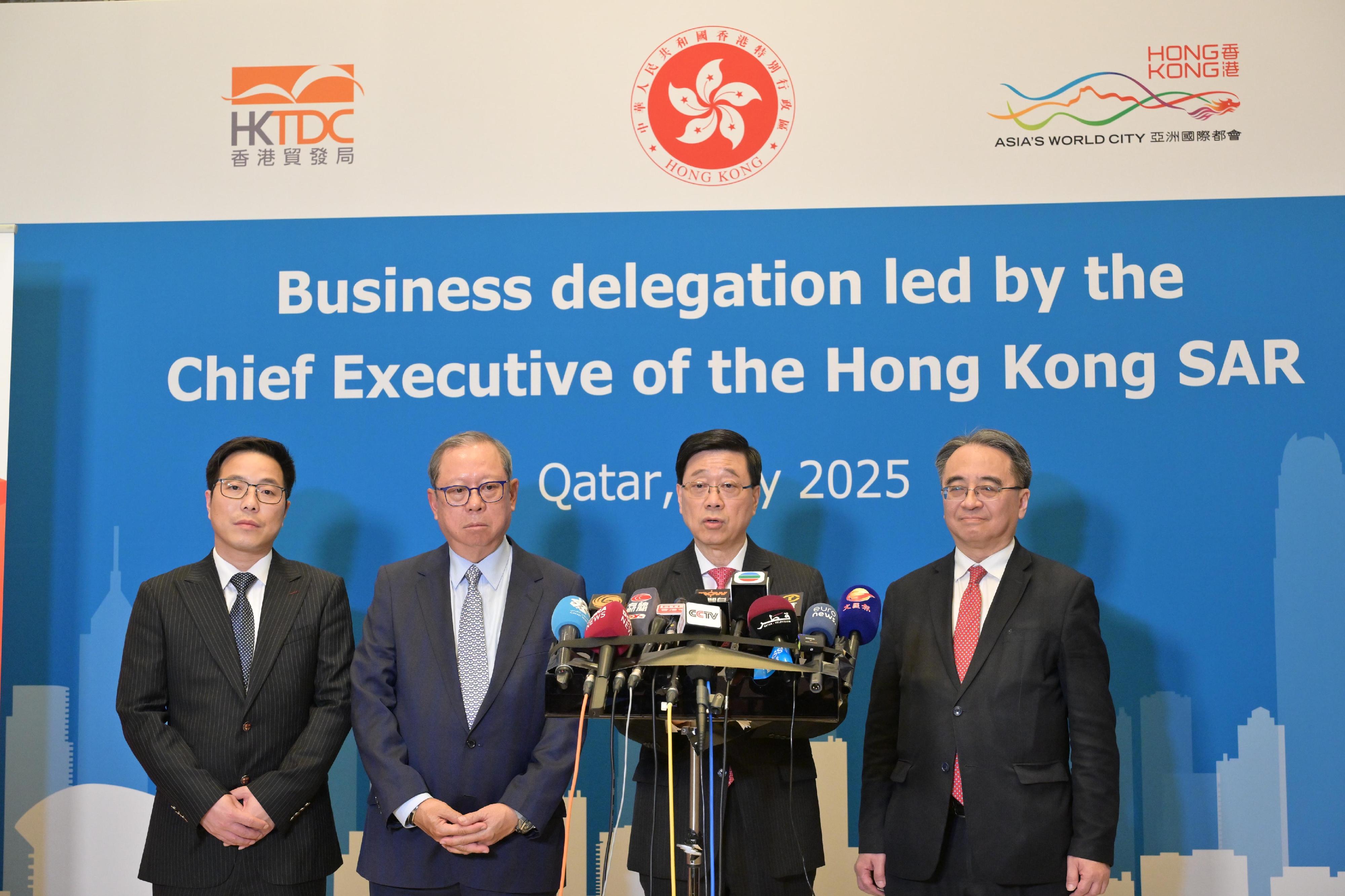 The Chief Executive, Mr John Lee (second right), together with the Chairman of the Hong Kong Trade Development Council, Dr Peter Lam (second left); the Chief Executive Officer of the MTR Corporation Limited, Dr Jacob Kam (first right); and the Chairman of the Luyi Investment Limited, Mr Yin Haijie (first left), meets the media in Qatar today (May 12).