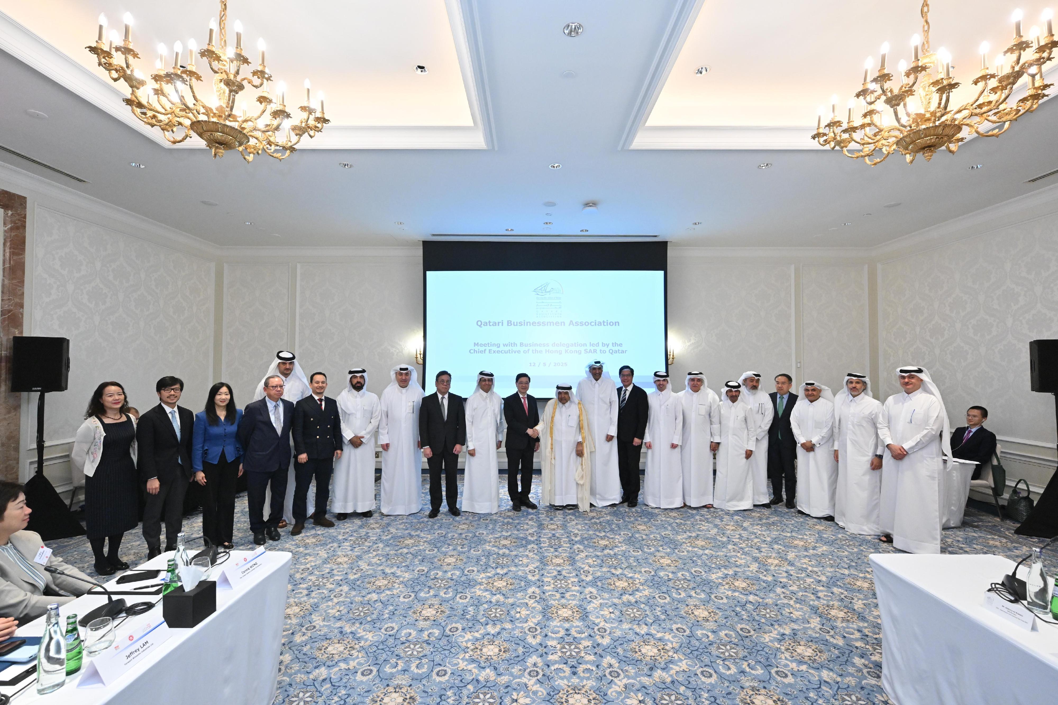 The Chief Executive, Mr John Lee (eleventh left), attends a roundtable meeting with Qatari Businessmen Association in Qatar today (May 12).