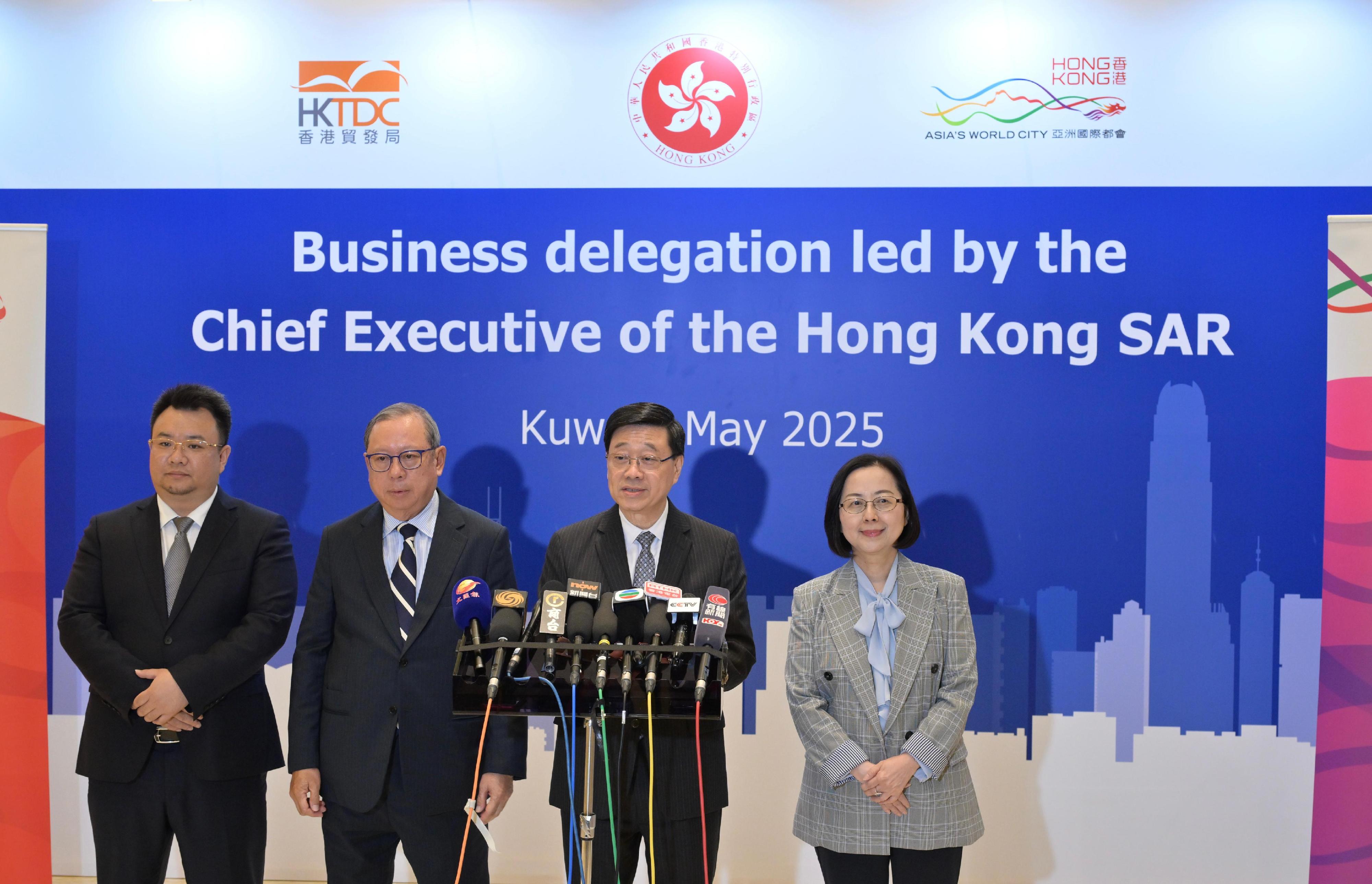 The Chief Executive, Mr John Lee (second right), together with the Chairman of the Hong Kong Trade Development Council, Dr Peter Lam (second left); the Chairman of the Hong Kong General Chamber of Commerce, Ms Agnes Chan (first right); and the Chairman of Dongchao Information Technology (Shanghai) Company Limited, Mr Wang Chaoyou (first left), meets the media in Kuwait today (May 14).