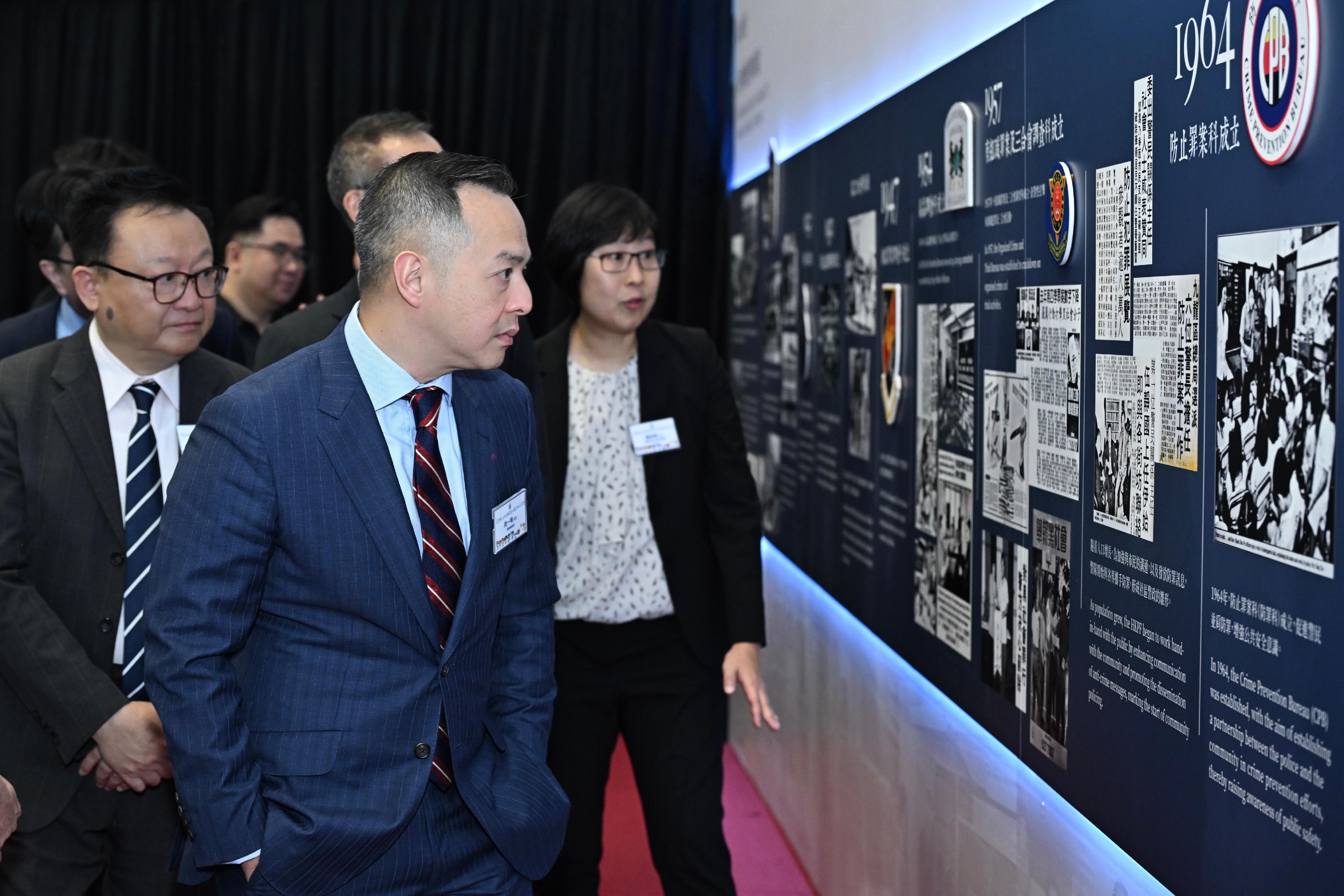 The Crime Prevention Bureau of the Hong Kong Police Force held the SafeCity Ambassadors Appointment and Recognition Ceremony 2025 today (May 16). The Commissioner of Police, Mr Chow Yat-ming (front row, left), together with guests, tour around the "Timeline" exhibition held at the venue, which offers a review of the Force's crime prevention strategies since its establishment in 1844. 