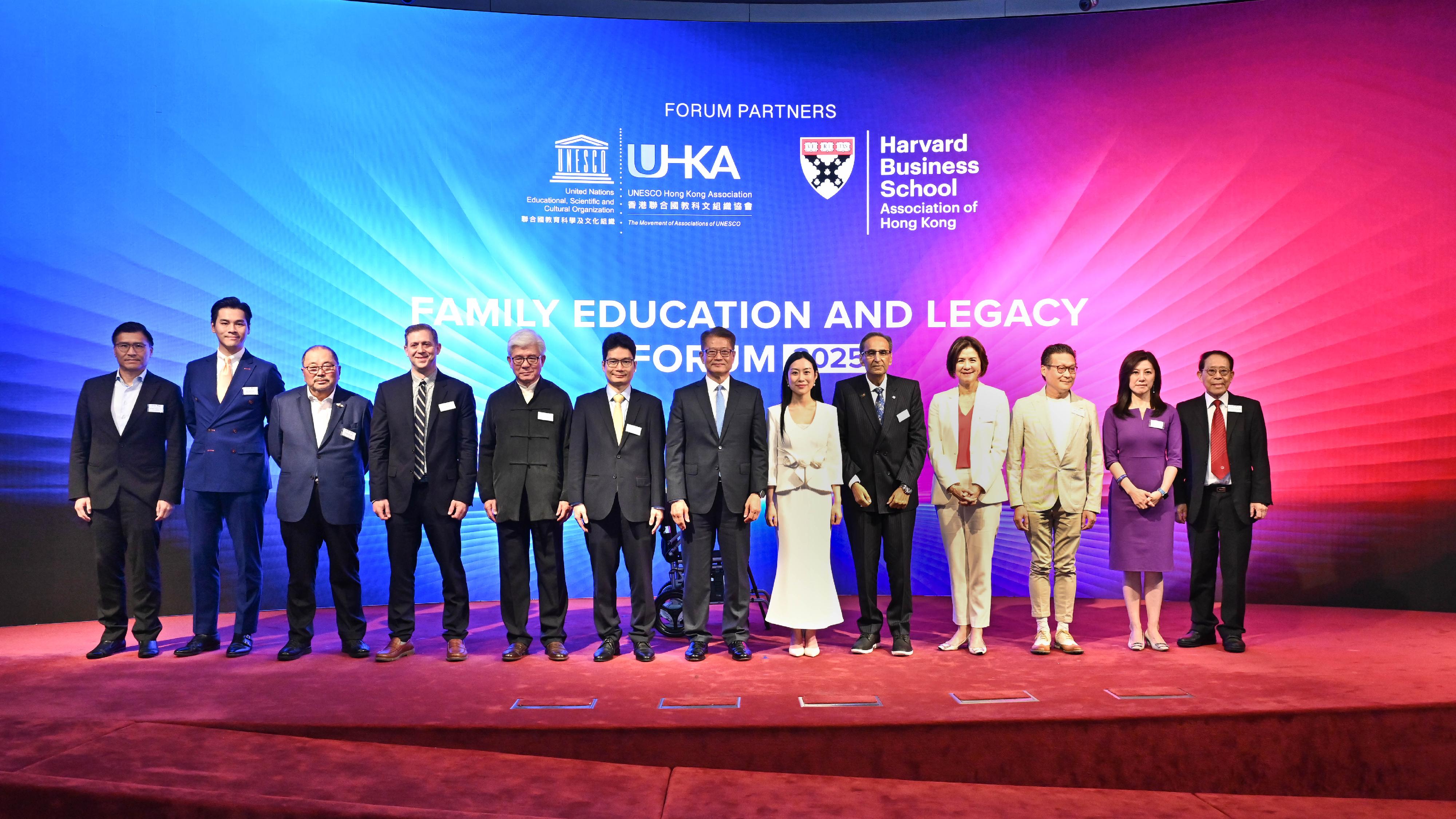 The Financial Secretary, Mr Paul Chan, attends the Family Education and Legacy Forum 2025 today (May 17).  Photo shows Mr Chan (centre), the Under Secretary for Financial Services and the Treasury, Mr Joseph Chan (sixth left), Chair of the Organising Committee of the Forum, Ms Yanice Mak (sixth right) in a group photo with other guests.