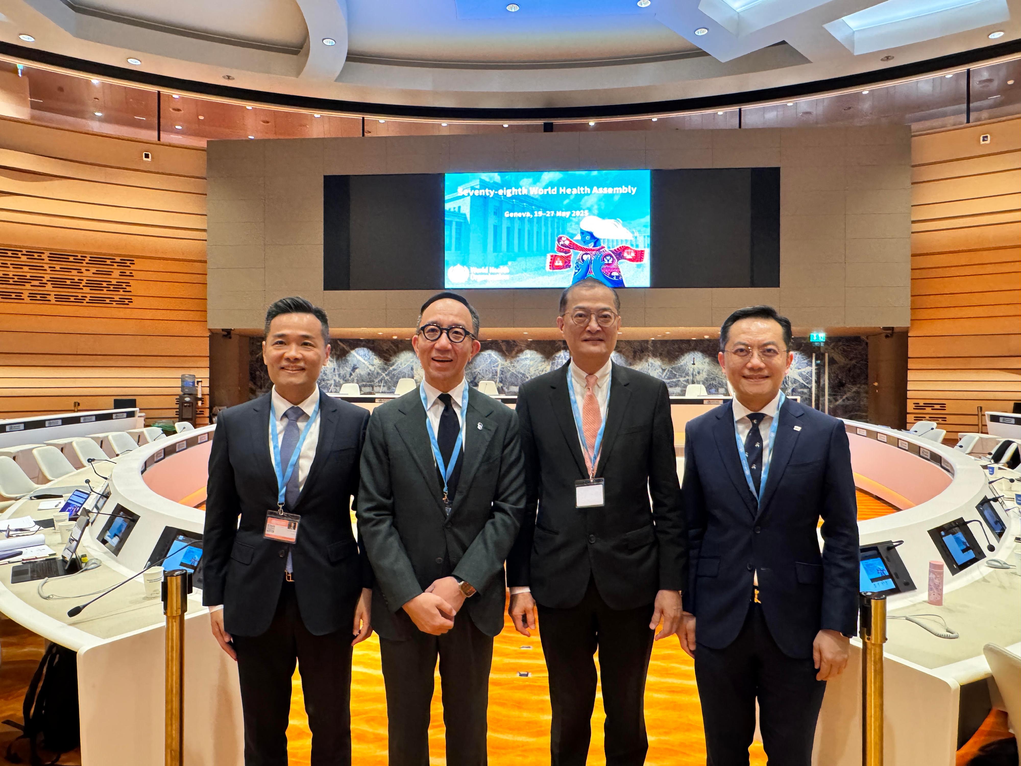 The Secretary for Health, Professor Lo Chung-mau, and the Director of Health, Dr Ronald Lam, attended the 78th World Health Assembly of the World Health Organization as members of the Chinese delegation in Geneva, Switzerland, yesterday (May 19, Geneva time). Photo shows Professor Lo (second right) and Dr Lam (first right), the Director of the Health Bureau of the Macao Special Administrative Region Government, Dr Lo Iek-long (first left) and the Executive Director of the Charities and Community, the Hong Kong Jockey Club, Dr Gabriel Leung (second left).
