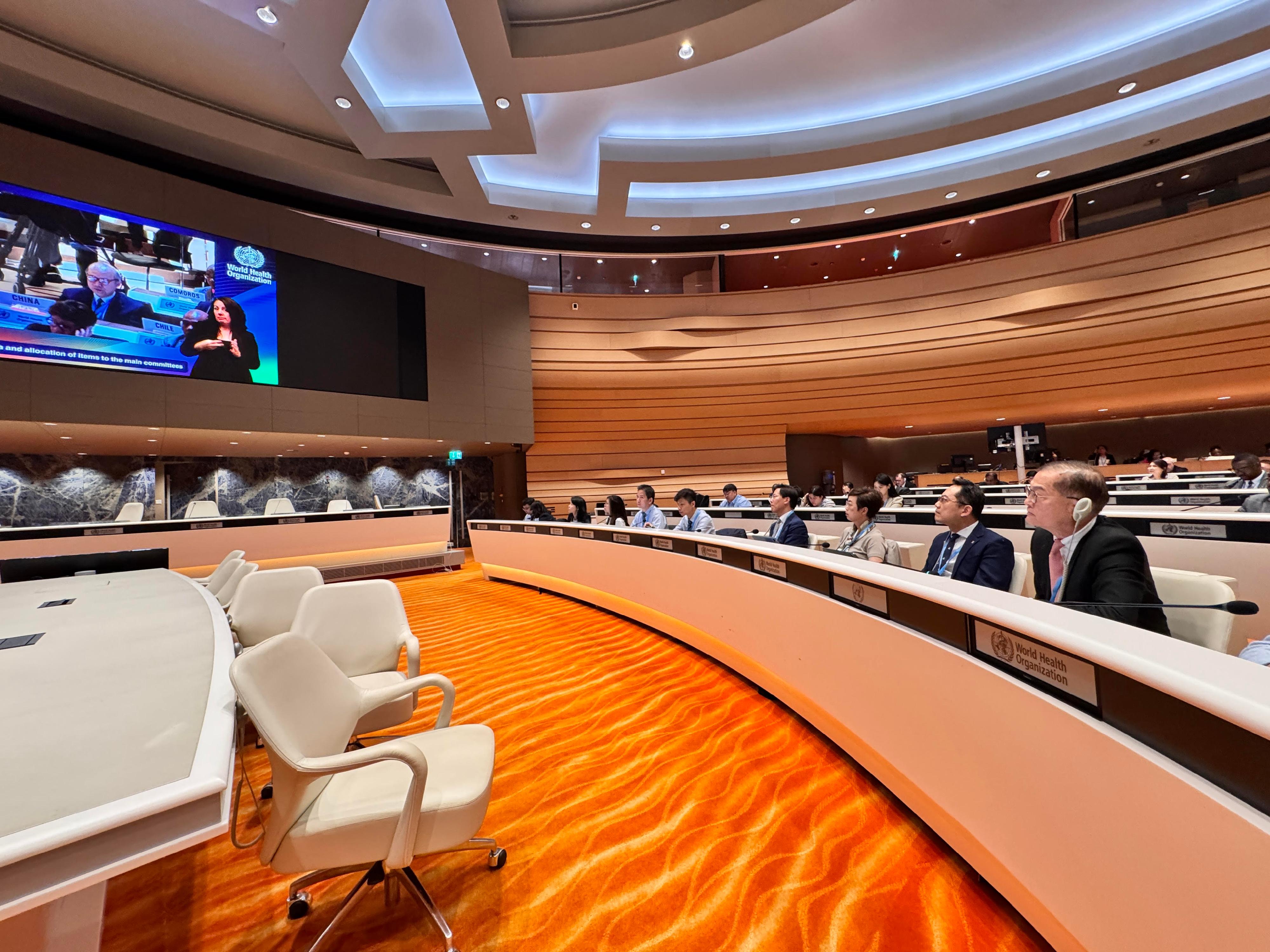 The Secretary for Health, Professor Lo Chung-mau, and the Director of Health, Dr Ronald Lam, attended the 78th World Health Assembly of the World Health Organization (WHO) as members of the Chinese delegation in Geneva, Switzerland, yesterday (May 19, Geneva time). Photo shows Professor Lo (first right) and Dr Lam (second right) listening to the speech made by the Ambassador Extraordinary and Plenipotentiary, Permanent Representative of the People's Republic of China to the United Nations Office at Geneva and other International Organizations in Switzerland, Mr Chen Xu.
