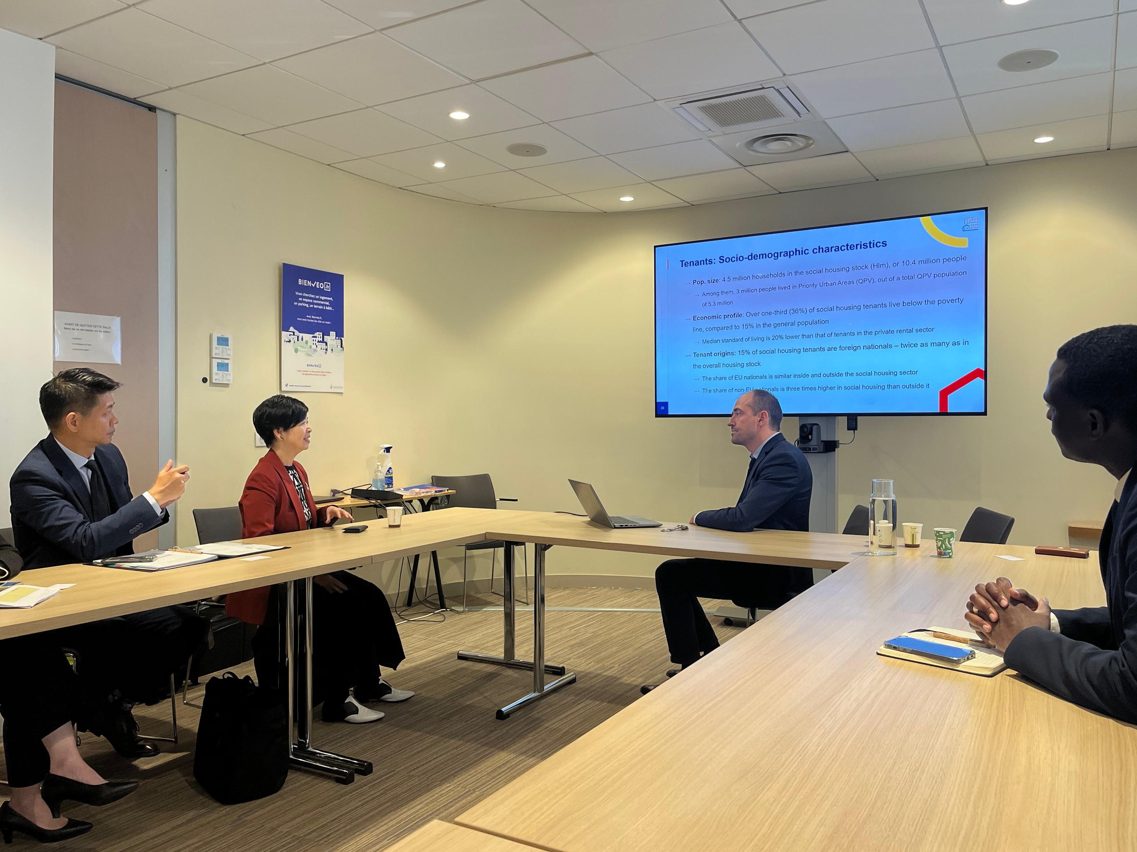 The Secretary for Housing, Ms Winnie Ho, continued her visit to Paris, France, yesterday (May 20, Paris time). Photo shows Ms Ho (second left) visiting the headquarters of a local social housing association, L'Union sociale pour l'habitat (USH), in the morning and meeting with the Director of Economic and Financial Studies at the USH, Mr Christophe Bellégo (second right), to learn about the organisation's work, including conducting research and analysis on local housing issues, contributing to their government's policy formulation.