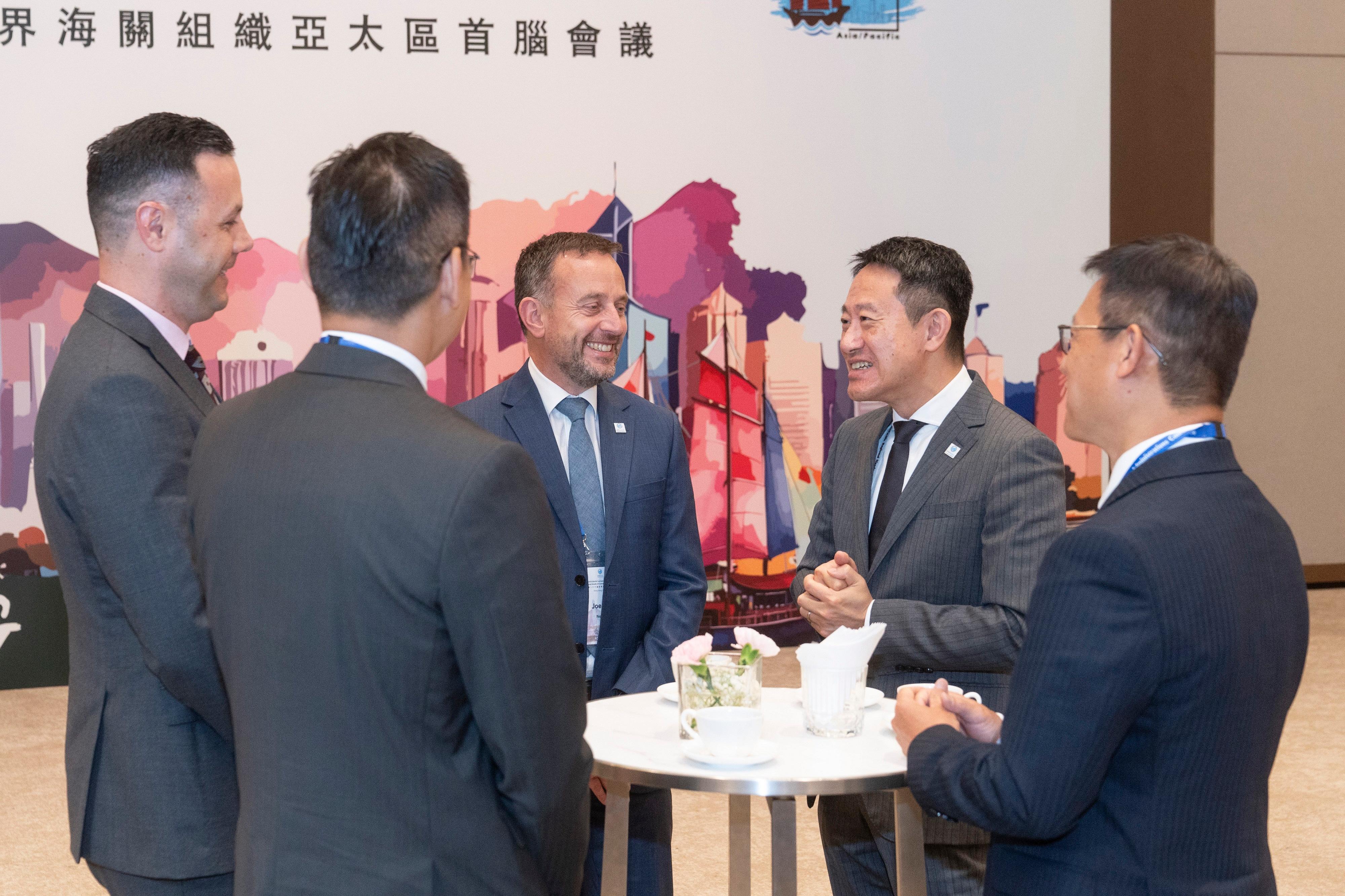 The 26th World Customs Organization Asia/Pacific Regional Heads of Customs Administrations Conference held by Hong Kong Customs concluded today (May 22). Photo shows the Commissioner of Customs and Excise, Mr Chan Tsz-tat (second right), exchanging views with Deputy Chief Executive of New Zealand Customs Service Mr Joe Cannon (centre) during an intersession of the Conference on May 20.