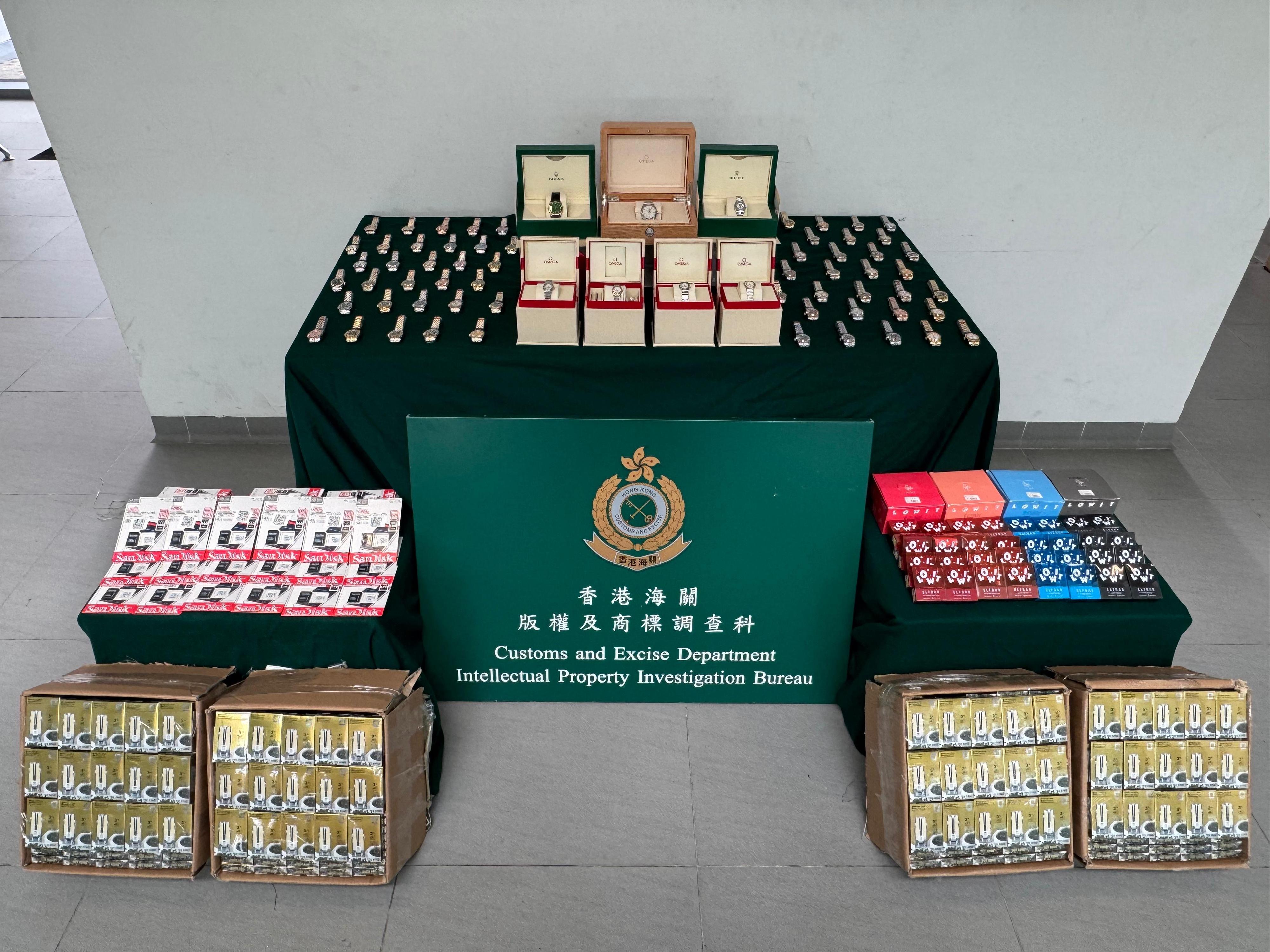 Hong Kong Customs on May 6 seized about 1 300 suspected counterfeit goods and about 2 400 alternative smoking products with a total estimated market value of about $1.5 million at the Hong Kong-Zhuhai-Macao Bridge Hong Kong Port. Photo shows the suspected counterfeit goods and alternative smoking products seized.
