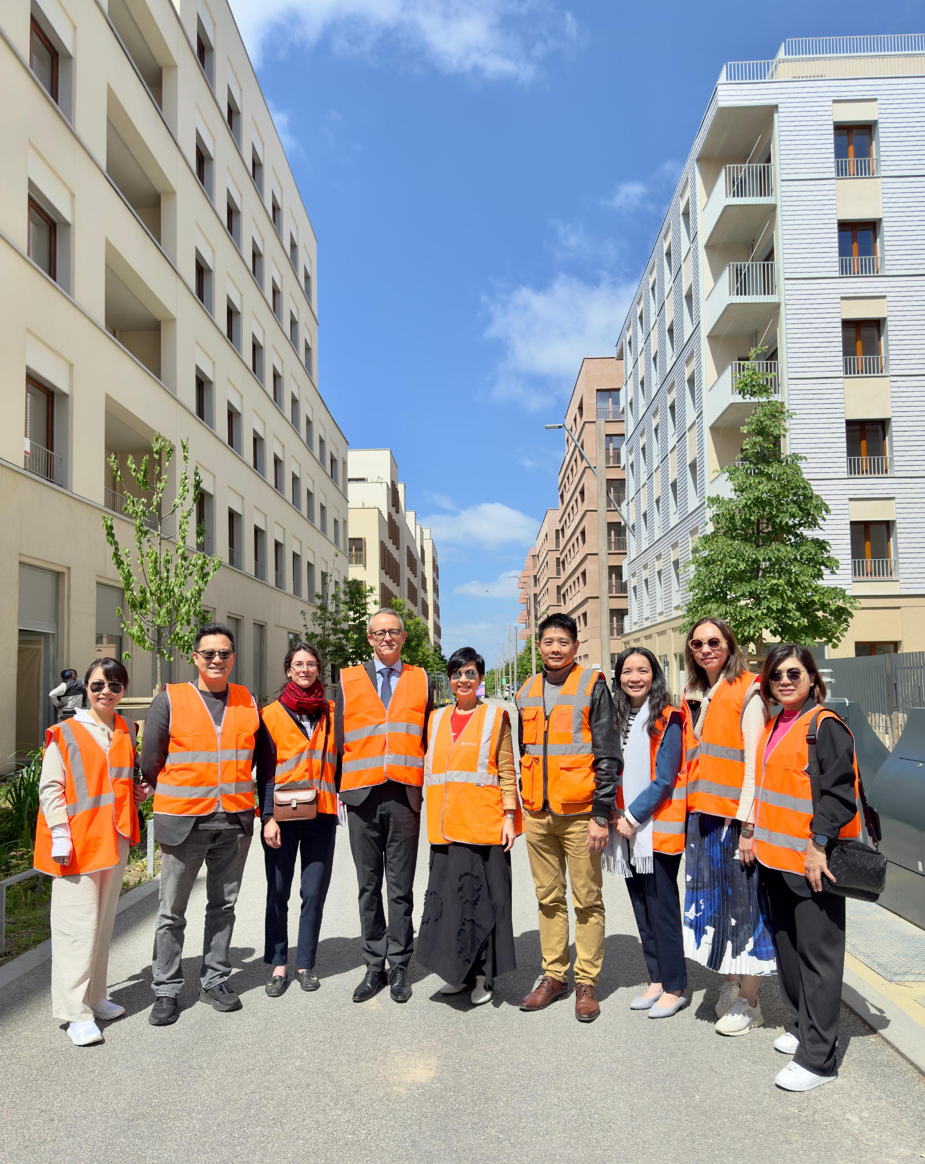 The Secretary for Housing, Ms Winnie Ho, concluded her visit to Paris, France, yesterday (May 22, Paris time). Photo shows Ms Ho (centre) visiting an integrated residential and commercial community comprising social housing, which was transformed from the Olympic Athletes' Village, to learn about sustainable urban development.