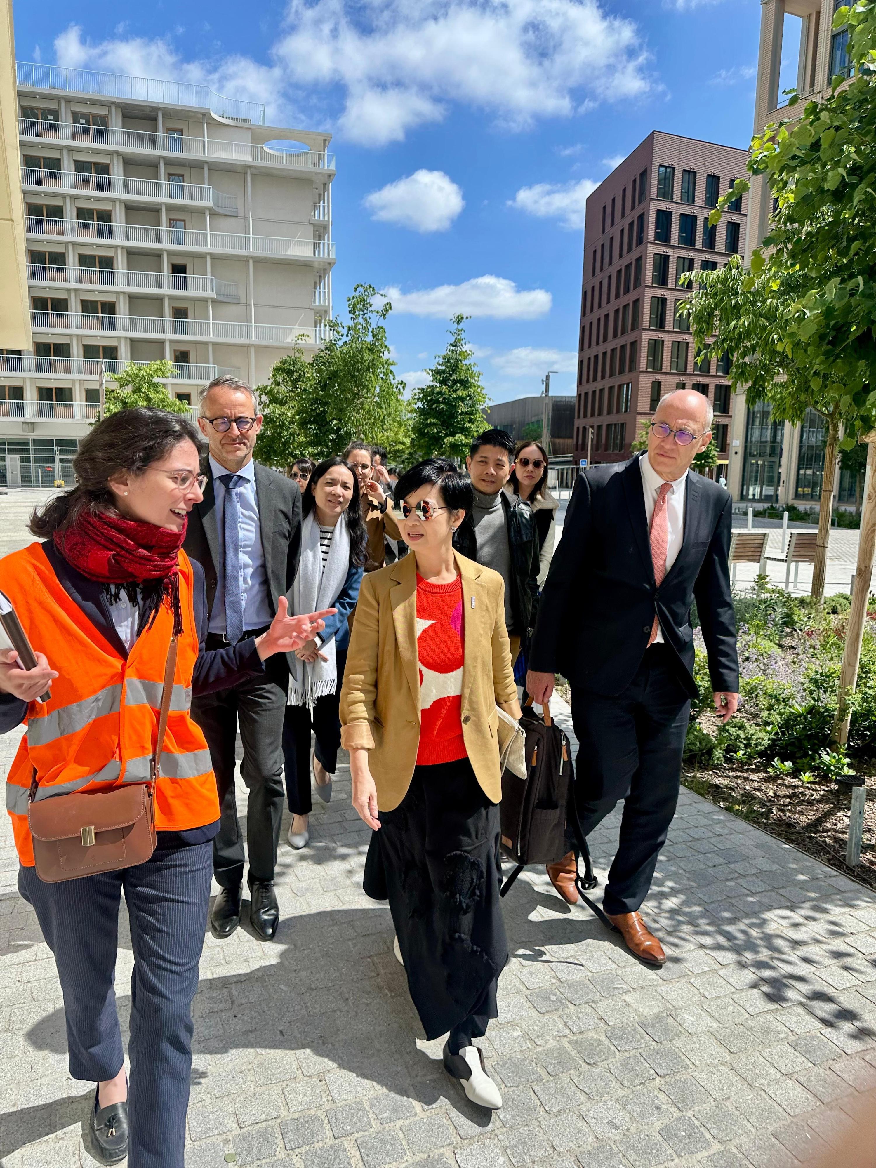 The Secretary for Housing, Ms Winnie Ho, concluded her visit to Paris, France, yesterday (May 22, Paris time). Photo shows Ms Ho (centre) visiting an integrated residential and commercial community comprising social housing, which was transformed from the Olympic Athletes' Village, to learn about sustainable urban development.