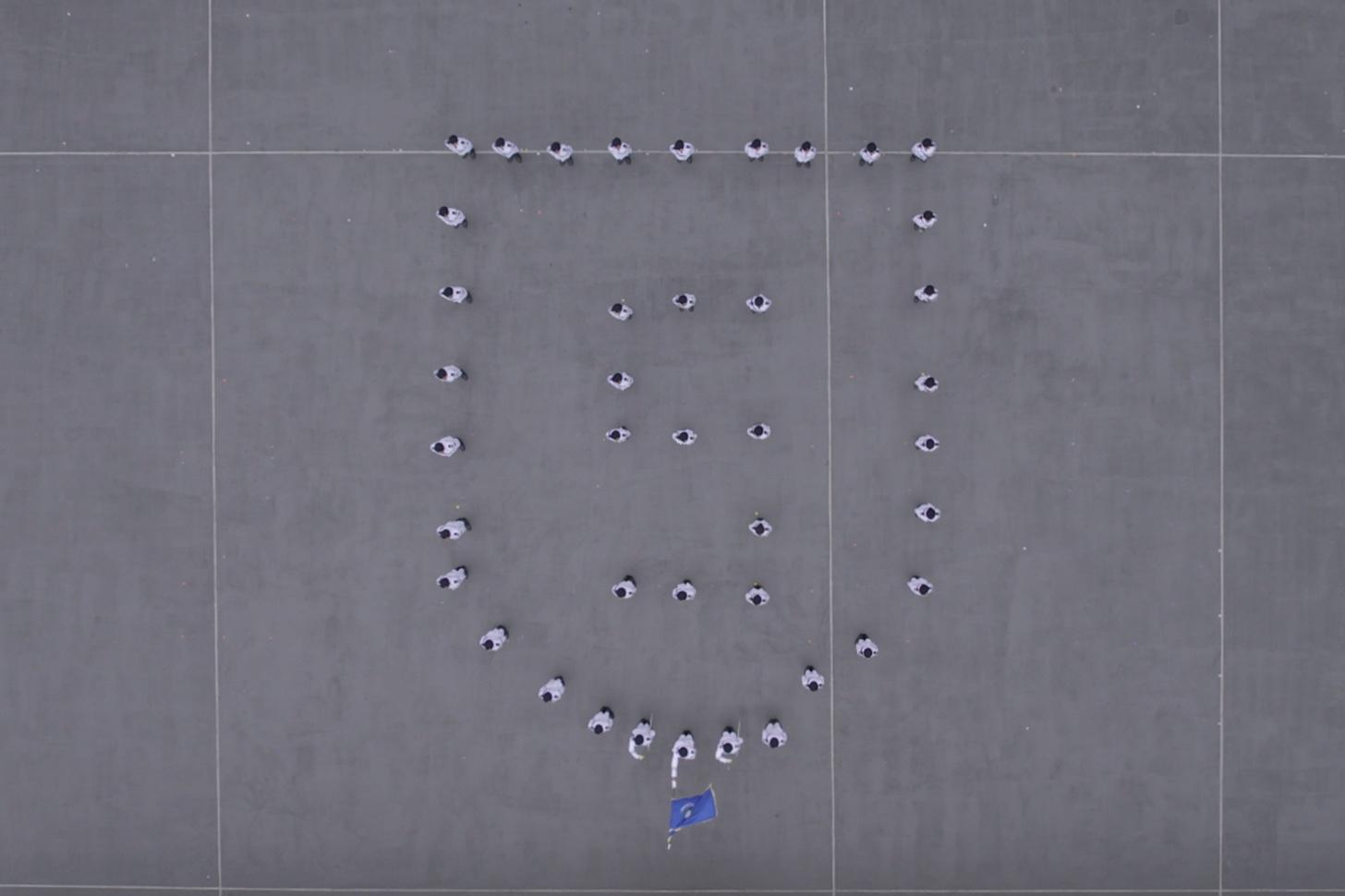The Immigration Department held the Grand Immigration Department Youth Leaders Corps (IDYL) Parade cum Promotion Ceremony 2025 at the Immigration Service Institute of Training and Development in Tuen Mun today (May 25). Photo shows the IDYL Guard of Honour forming a shield pattern and the Arabic numeral "5" to celebrate the fifth anniversary of the implementation of the Hong Kong National Security Law. 
