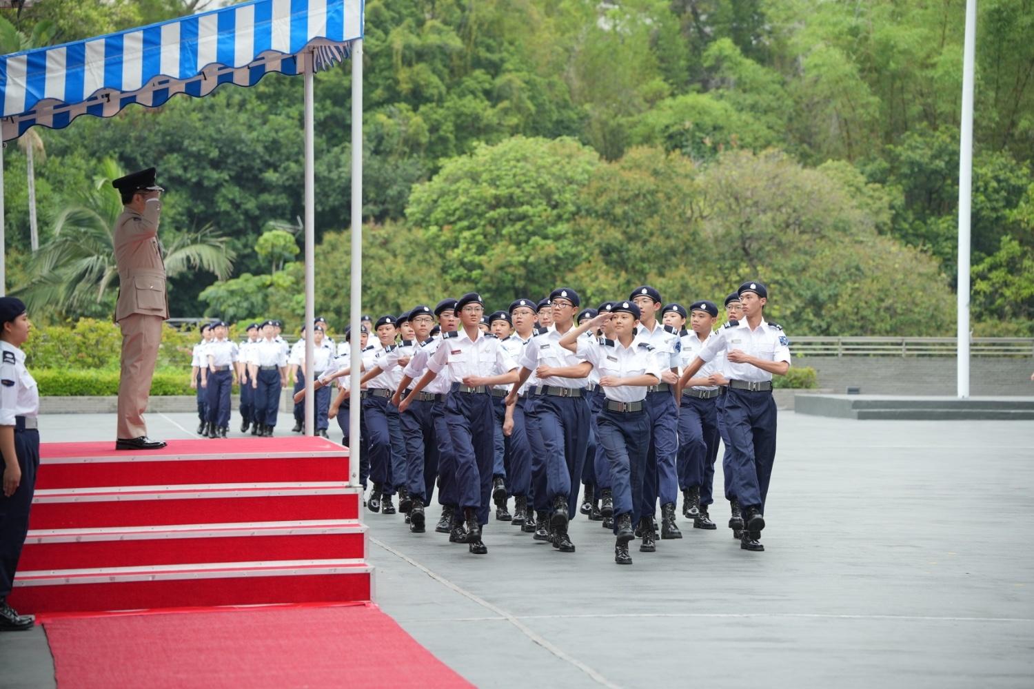 The Immigration Department held the Grand Immigration Department Youth Leaders Corps (IDYL) Parade cum Promotion Ceremony 2025 at the Immigration Service Institute of Training and Development in Tuen Mun today (May 25). Photo shows members of IDYL goose-stepping past the dais in the Chinese-style foot drill performance.