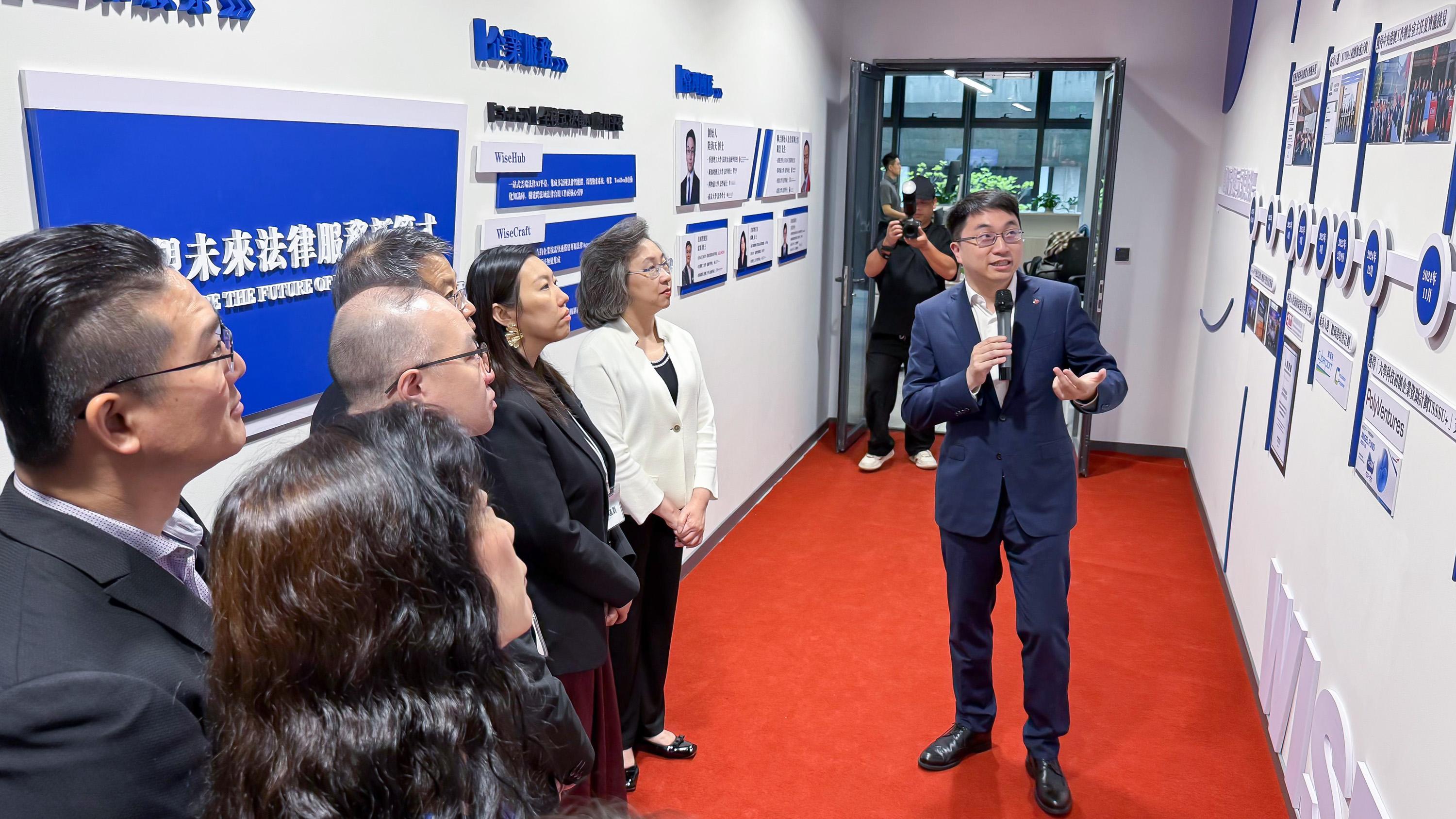 The Legislative Council (LegCo) Panel on Public Service conducted a duty visit to Shenzhen today (May 26). Photo shows LegCo Members visiting an innovative and technology company in Nanshan District.
