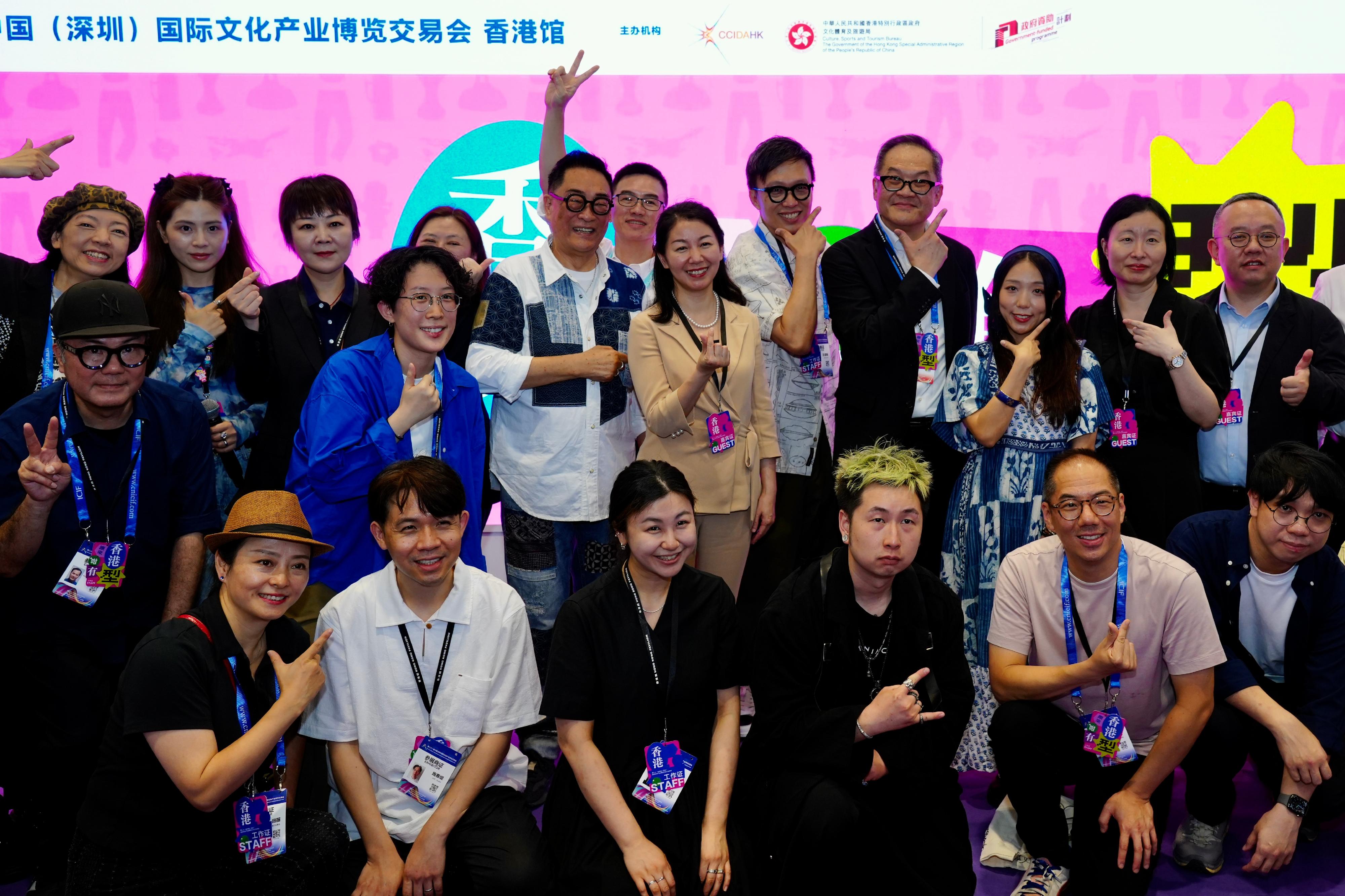 The Cultural and Creative Industries Development Agency under the Culture, Sports and Tourism Bureau led an industry delegation to participate in the 21st China (Shenzhen) International Cultural Industries Fair. Photo shows the Commissioner for Cultural and Creative Industries, Mr Victor Tsang (back row, fourth right), and industry representatives at the opening ceremony of the Hong Kong Pavilion on May 22.